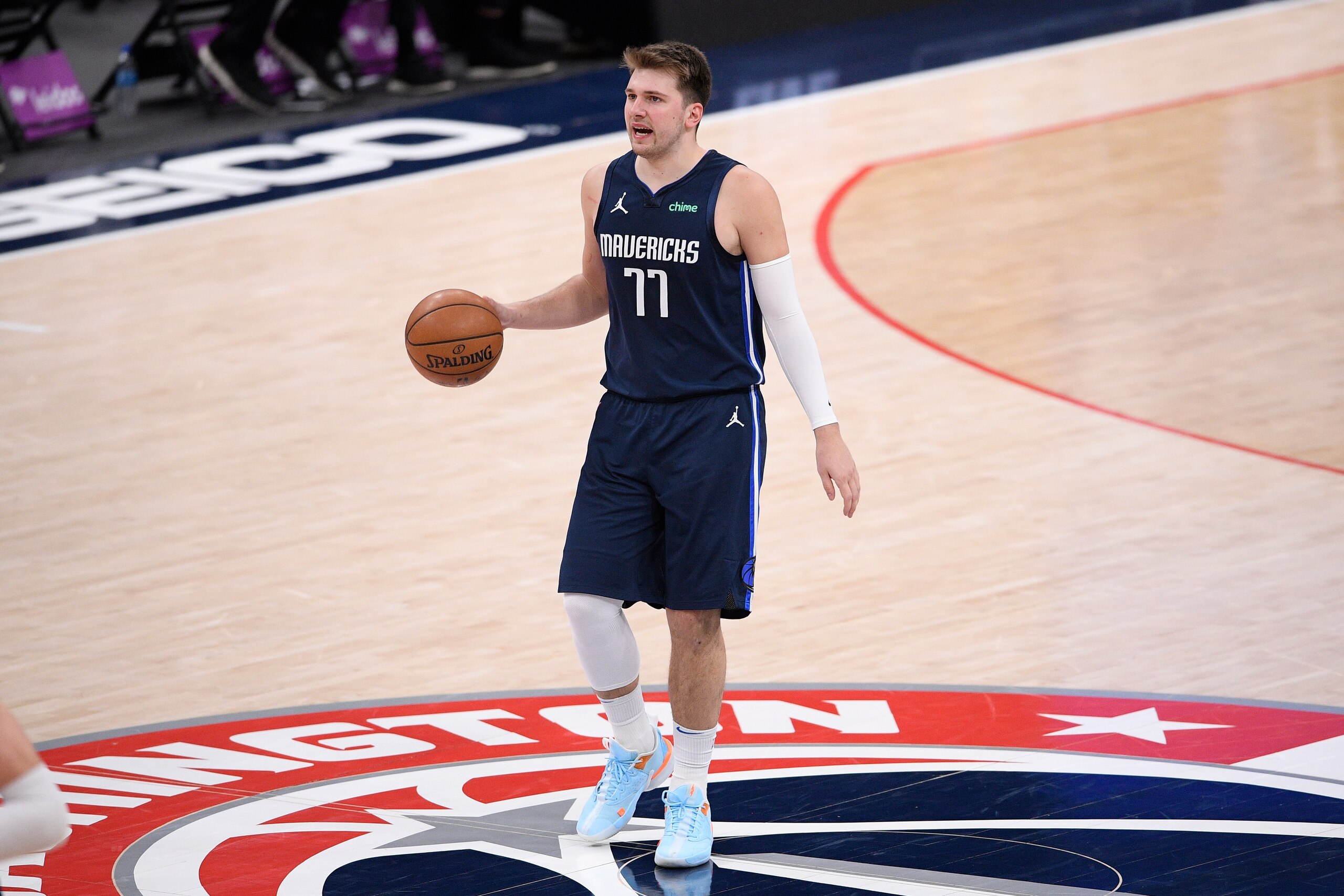 Dallas Mavericks guard Luka Doncic (77) dribbles the ball during the second half of an NBA basketball game against the Washington Wizards, Saturday, April 3, 2021, in Washington. (AP Photo/Nick Wass)