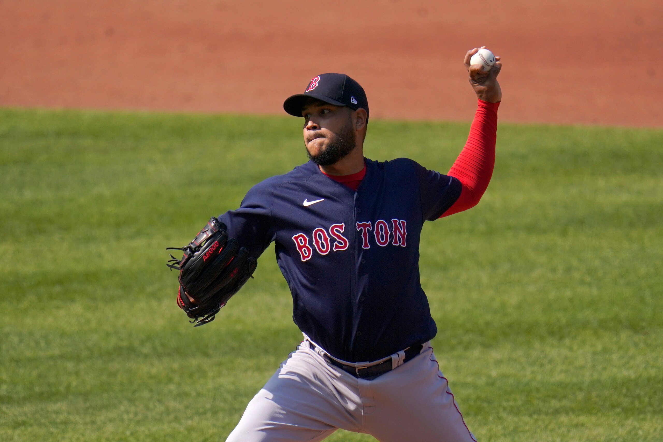 Boston Red Sox starting pitcher Eduardo Rodriguez throws a pitch against the Baltimore Orioles during the first inning of a baseball game, Thursday, April 8, 2021, on Opening Day in Baltimore. (AP Photo/Julio Cortez)
