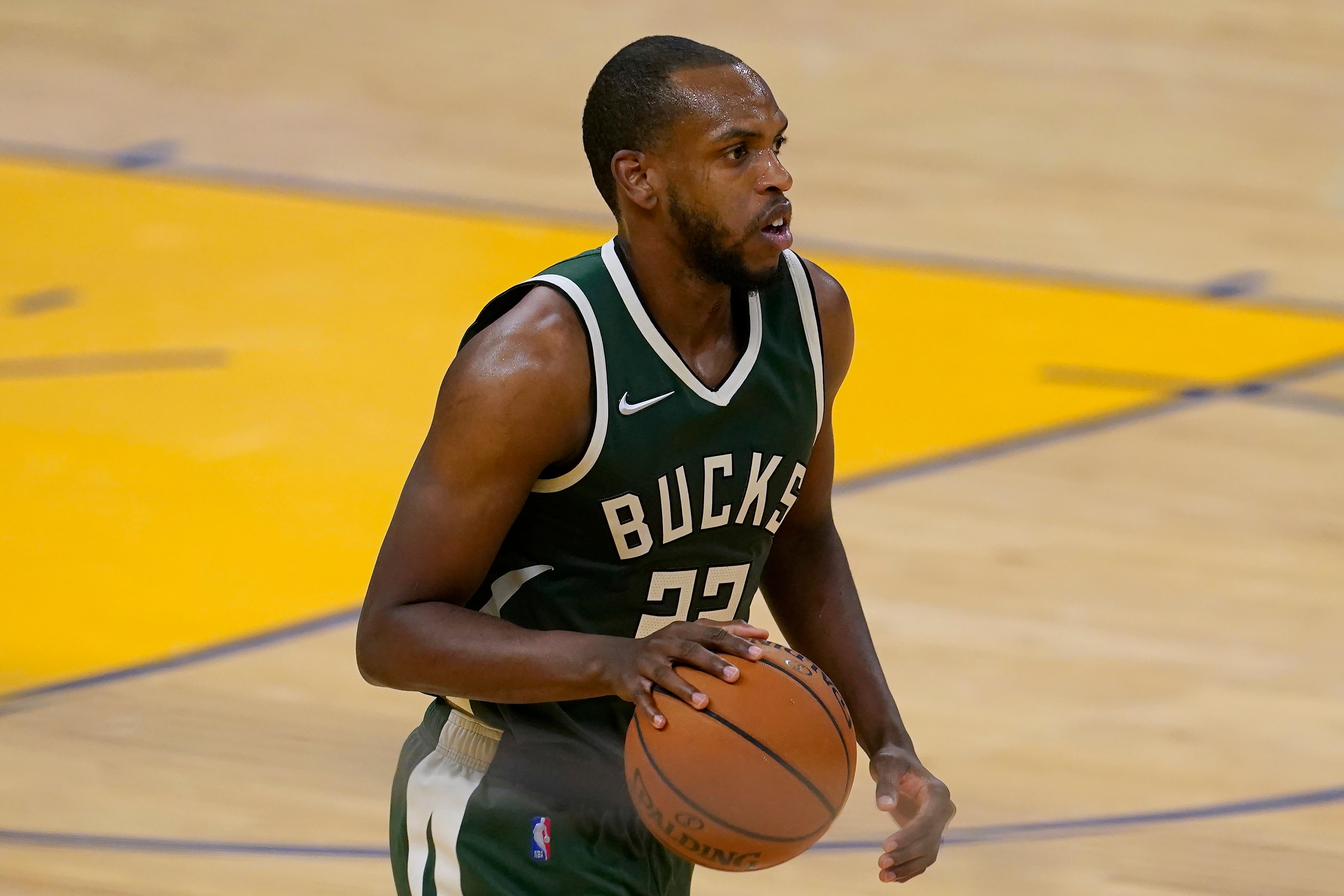Milwaukee Bucks forward Khris Middleton brings the ball up against the Golden State Warriors during the second half of an NBA basketball game in San Francisco, Tuesday, April 6, 2021. (AP Photo/Jeff Chiu)