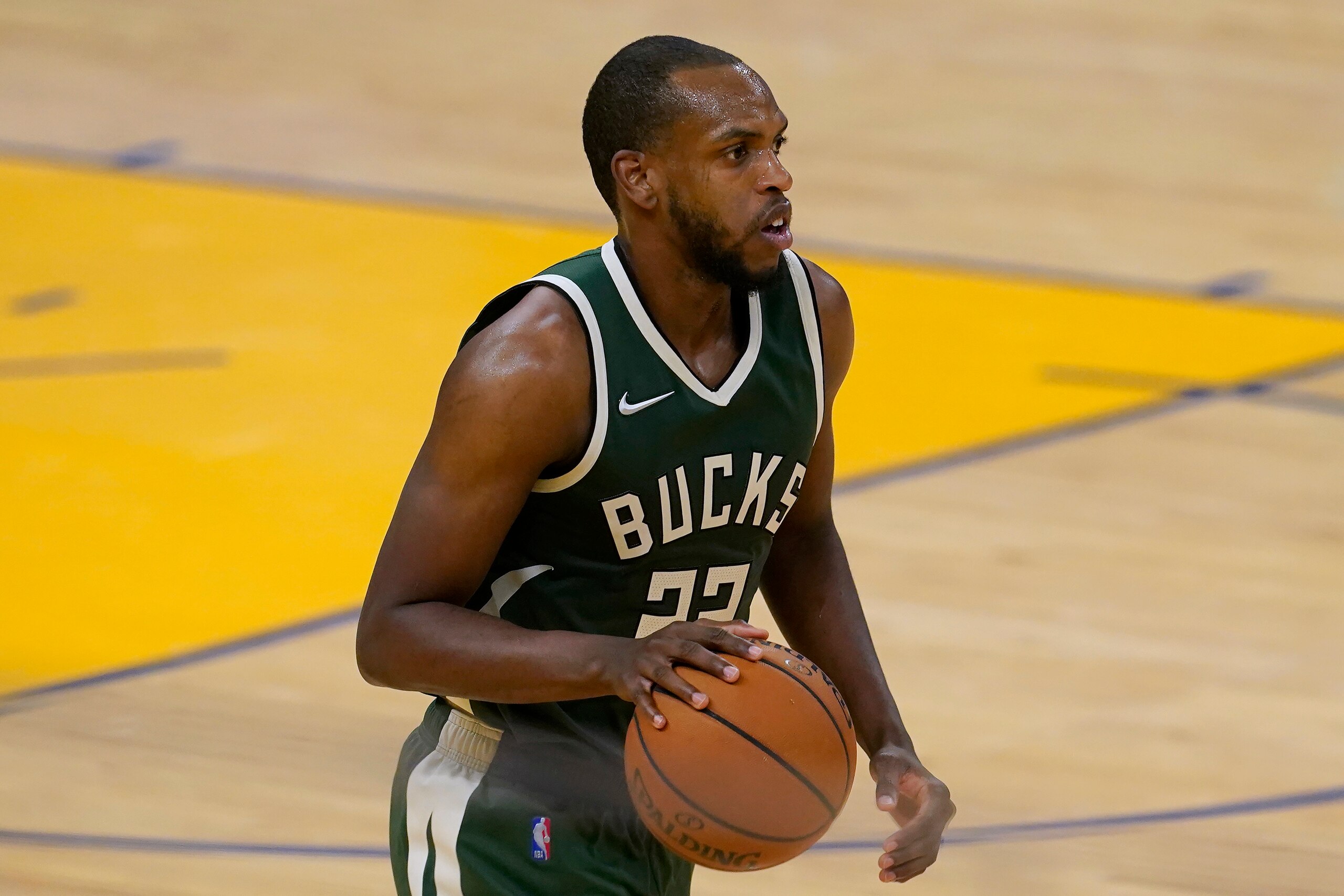 Milwaukee Bucks forward Khris Middleton brings the ball up against the Golden State Warriors during the second half of an NBA basketball game in San Francisco, Tuesday, April 6, 2021. (AP Photo/Jeff Chiu)