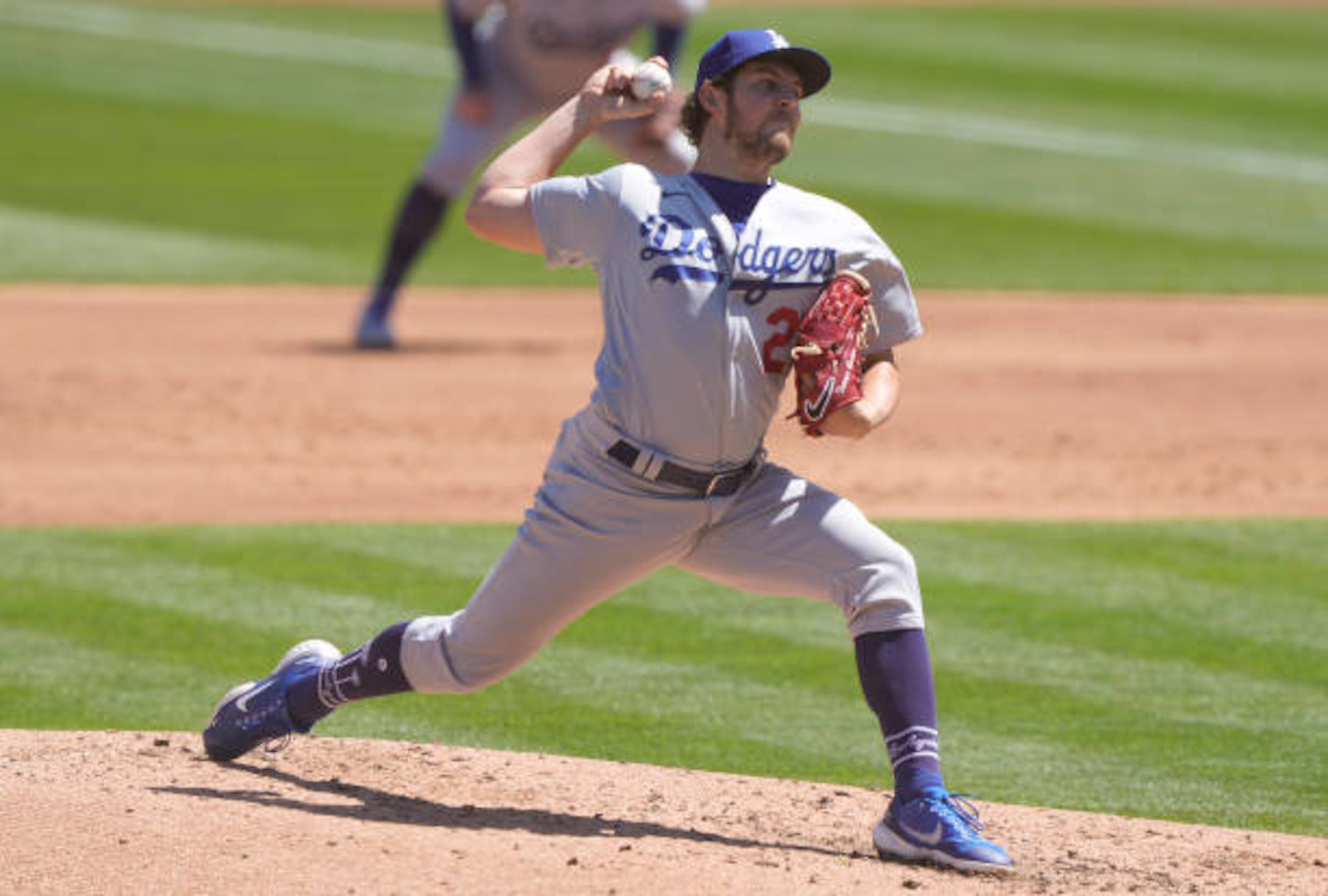 OAKLAND, CALIFORNIA - APRIL 07: Trevor Bauer #27 of the Los Angeles Dodgers pitches against the Oakland Athletics in the second inning at RingCentral Coliseum on April 07, 2021 in Oakland, California. (Photo by Thearon W. Henderson/Getty Images)