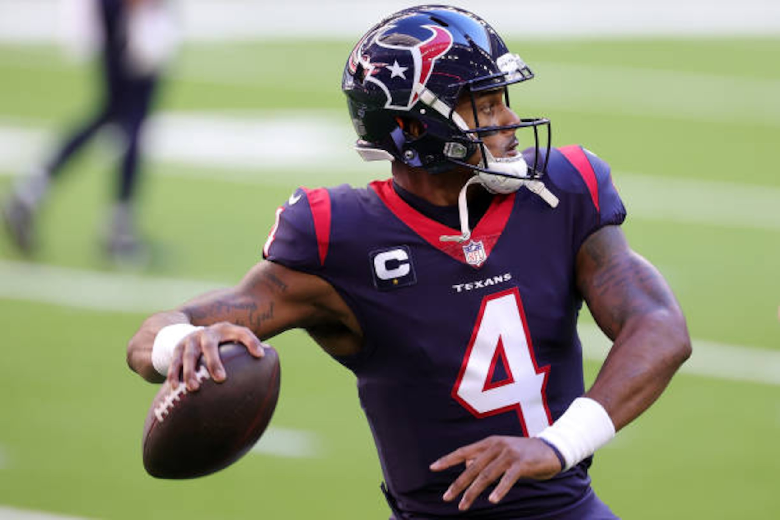 HOUSTON, TEXAS - JANUARY 03: Deshaun Watson #4 of the Houston Texans participates in warmups prior to a game against the Tennessee Titans at NRG Stadium on January 03, 2021 in Houston, Texas. (Photo by Carmen Mandato/Getty Images)