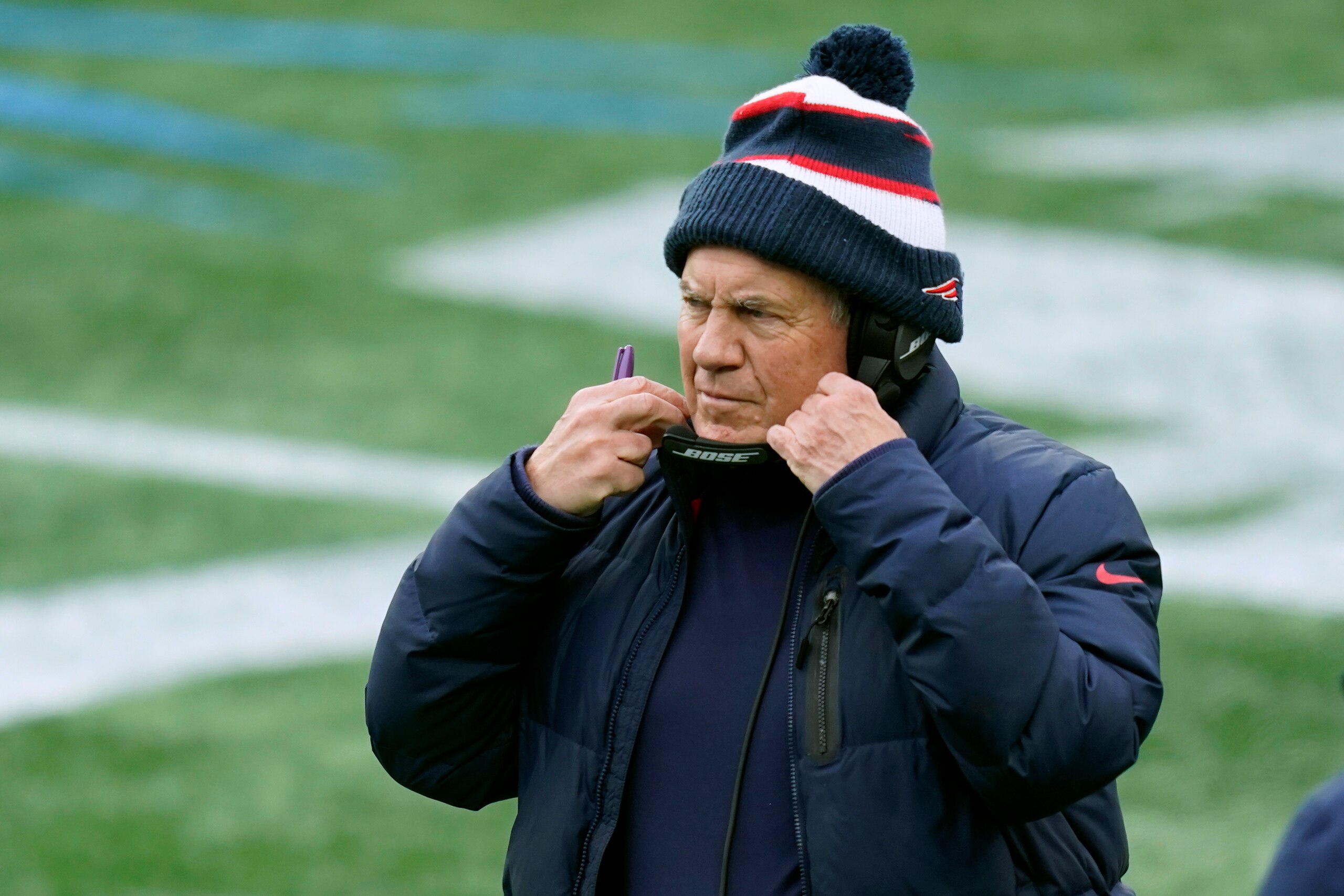 New England Patriots head coach Bill Belichick works along the sideline in the first half of an NFL football game against the New York Jets, Sunday, Jan. 3, 2021, in Foxborough, Mass. (AP Photo/Elise Amendola)