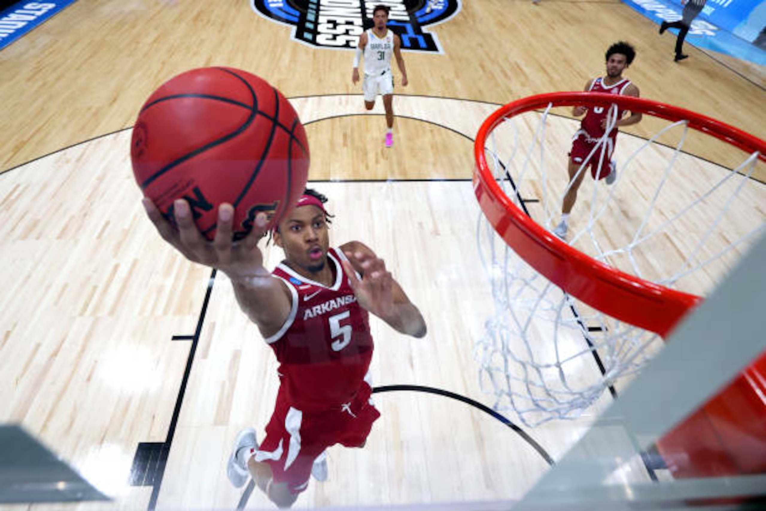 INDIANAPOLIS, IN - MARCH 29: Moses Moody #5 of the Arkansas Razorbacks scores against the Baylor Bears in the Elite Eight round of the 2021 NCAA Division I Men's Basketball Tournament held at Lucas Oil Stadium on March 29, 2021 in Indianapolis, Indiana. (Photo by Jamie Schwaberow/NCAA Photos via Getty Images)