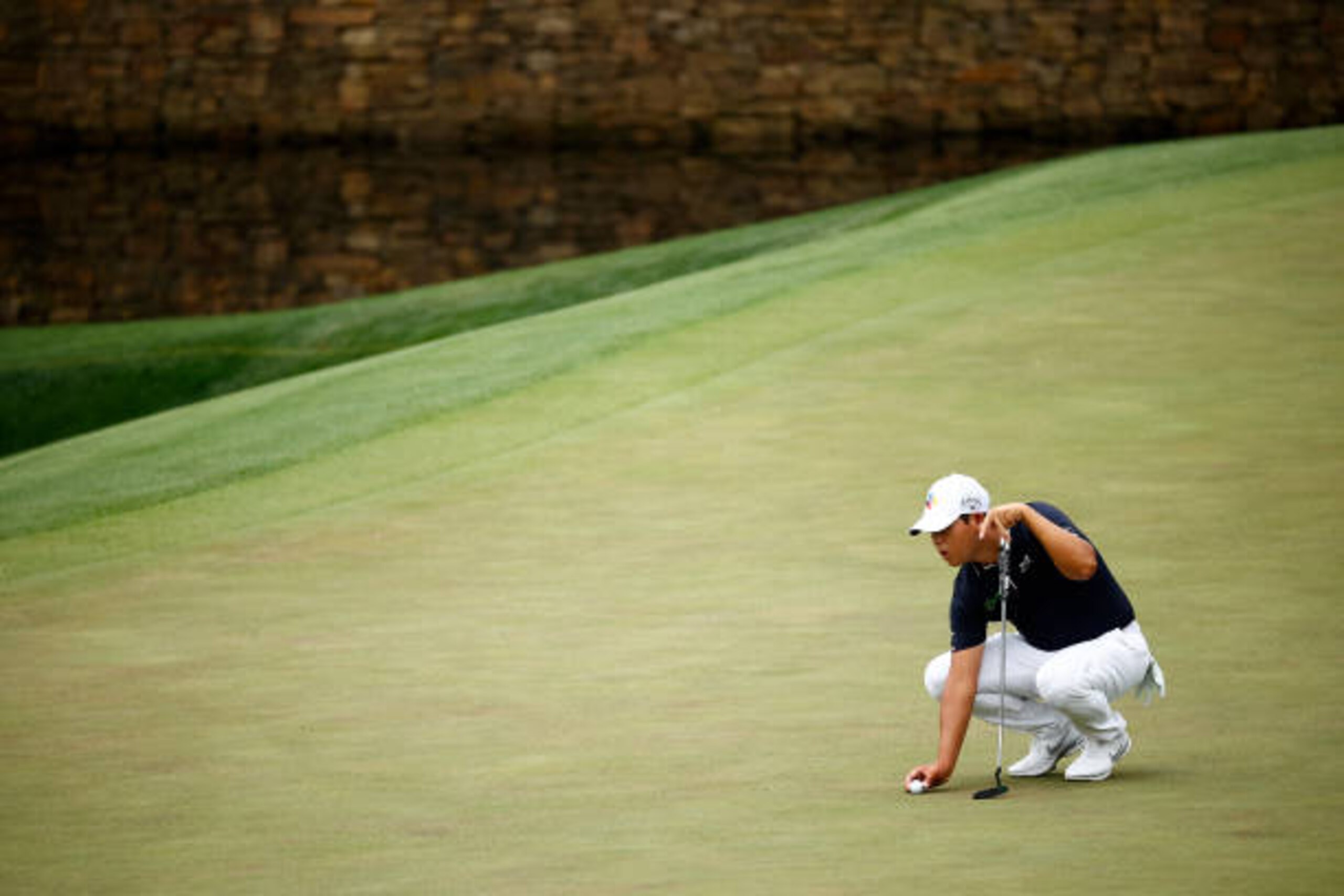 AUGUSTA, GEORGIA - APRIL 09: Si Woo Kim of South Korea lines up a putt \during the second round of the Masters at Augusta National Golf Club on April 09, 2021 in Augusta, Georgia. (Photo by Jared C. Tilton/Getty Images)