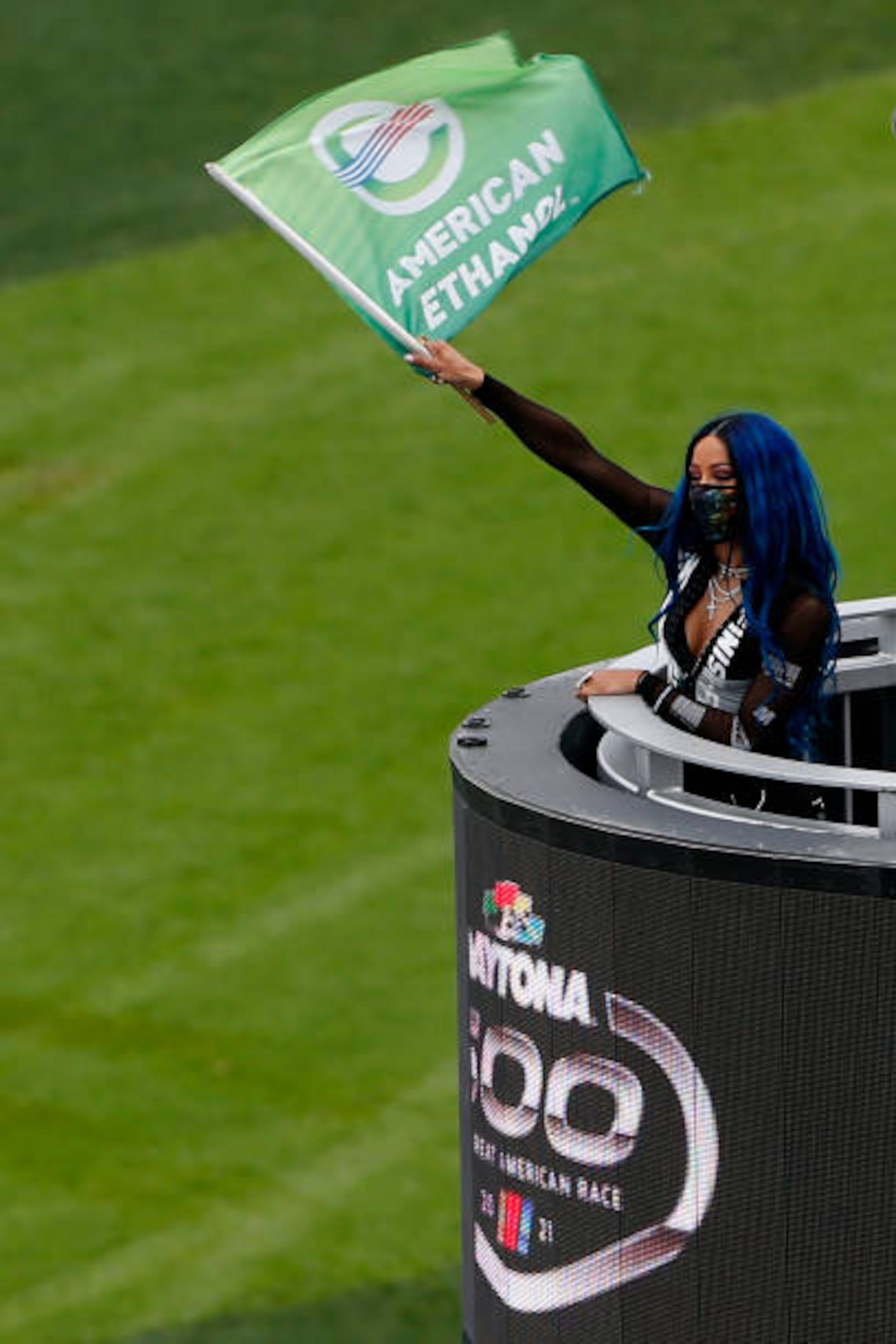 DAYTONA BEACH, FLORIDA - FEBRUARY 14: Honorary Starter Sasha Banks waves the green flag prior to the NASCAR Cup Series 63rd Annual Daytona 500 at Daytona International Speedway on February 14, 2021 in Daytona Beach, Florida. (Photo by Brian Lawdermilk/Getty Images) DAYTONA BEACH, FLORIDA - FEBRUARY 14: Honorary Starter Sasha Banks waves the green flag prior to the NASCAR Cup Series 63rd Annual Daytona 500 at Daytona International Speedway on February 14, 2021 in Daytona Beach, Florida. (Photo by Brian Lawdermilk/Getty Images)