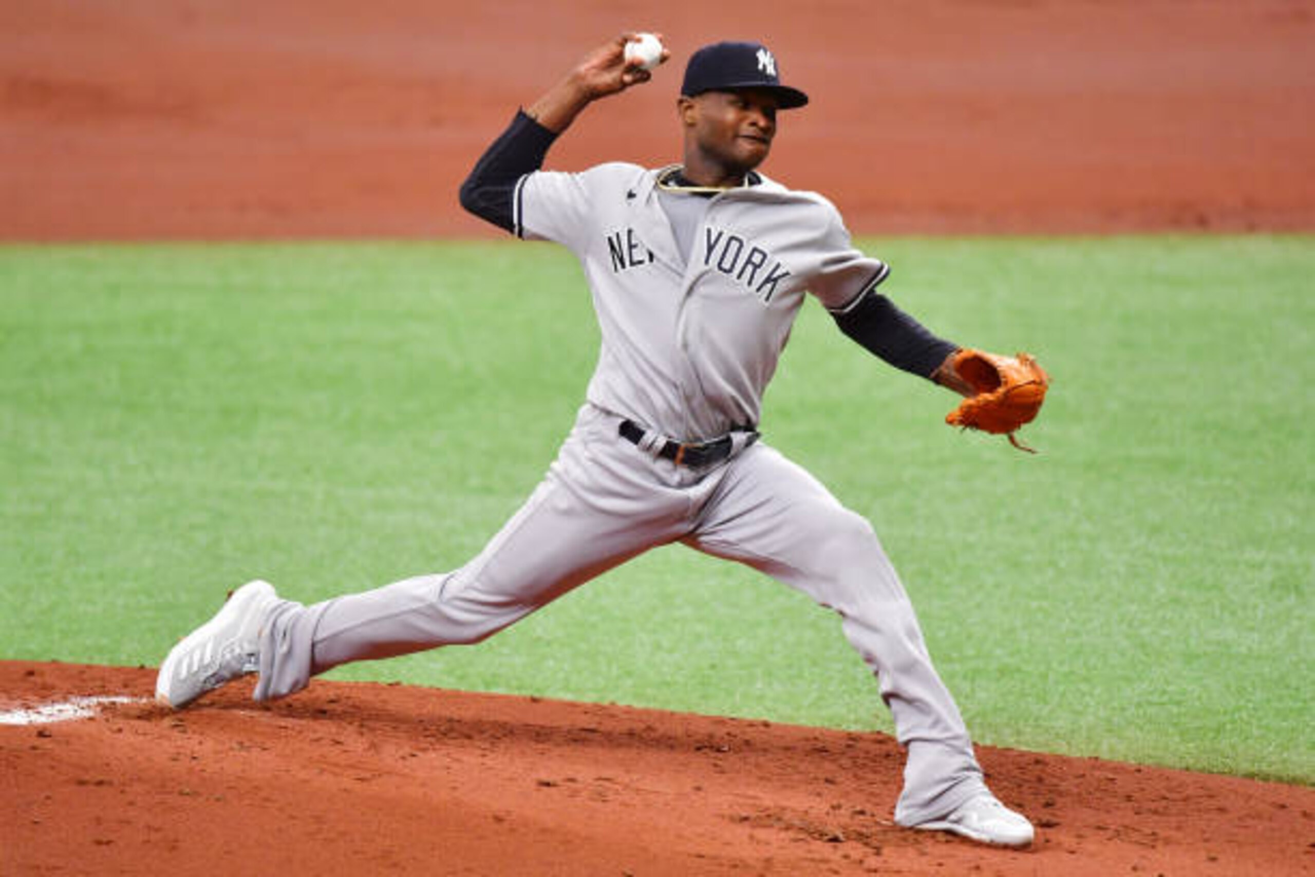ST PETERSBURG, FLORIDA - APRIL 10: Domingo German #55 of the New York Yankees delivers a pitch to the Tampa Bay Rays in the first inning at Tropicana Field on April 10, 2021 in St Petersburg, Florida. (Photo by Julio Aguilar/Getty Images) ST PETERSBURG, FLORIDA - APRIL 10: Domingo German #55 of the New York Yankees delivers a pitch to the Tampa Bay Rays in the first inning at Tropicana Field on April 10, 2021 in St Petersburg, Florida. (Photo by Julio Aguilar/Getty Images)