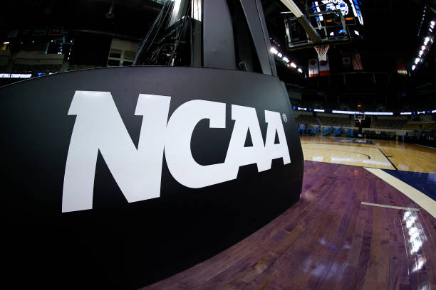 INDIANAPOLIS, INDIANA - MARCH 21: The NCAA logo is seen on the basket stanchion before the game between the Oral Roberts Golden Eagles and the Florida Gators in the second round game of the 2021 NCAA Men's Basketball Tournament at Indiana Farmers Coliseum on March 21, 2021 in Indianapolis, Indiana. (Photo by Maddie Meyer/Getty Images)