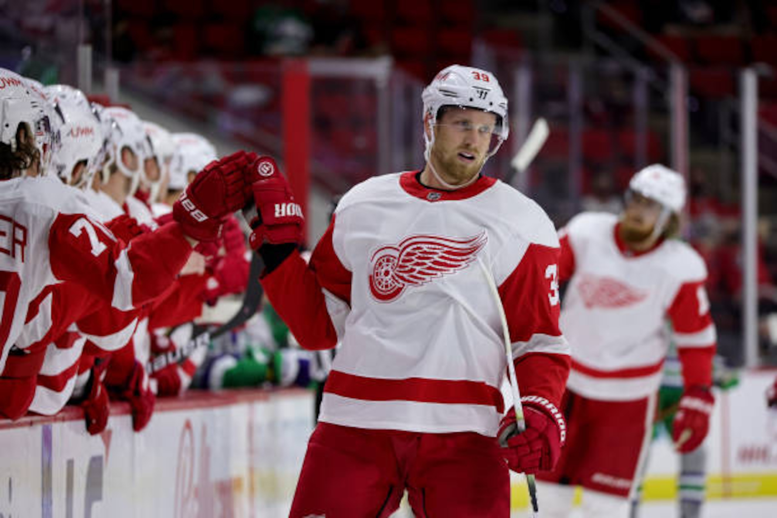 RALEIGH, NC - APRIL 10: Anthony Mantha #39 of the Detroit Red Wings scores a goal and skates back to the bench to celebrate with teammates during an NHL game against the Carolina Hurricanes on April 10, 2021 at PNC Arena in Raleigh, North Carolina. (Photo by Gregg Forwerck/NHLI via Getty Images)