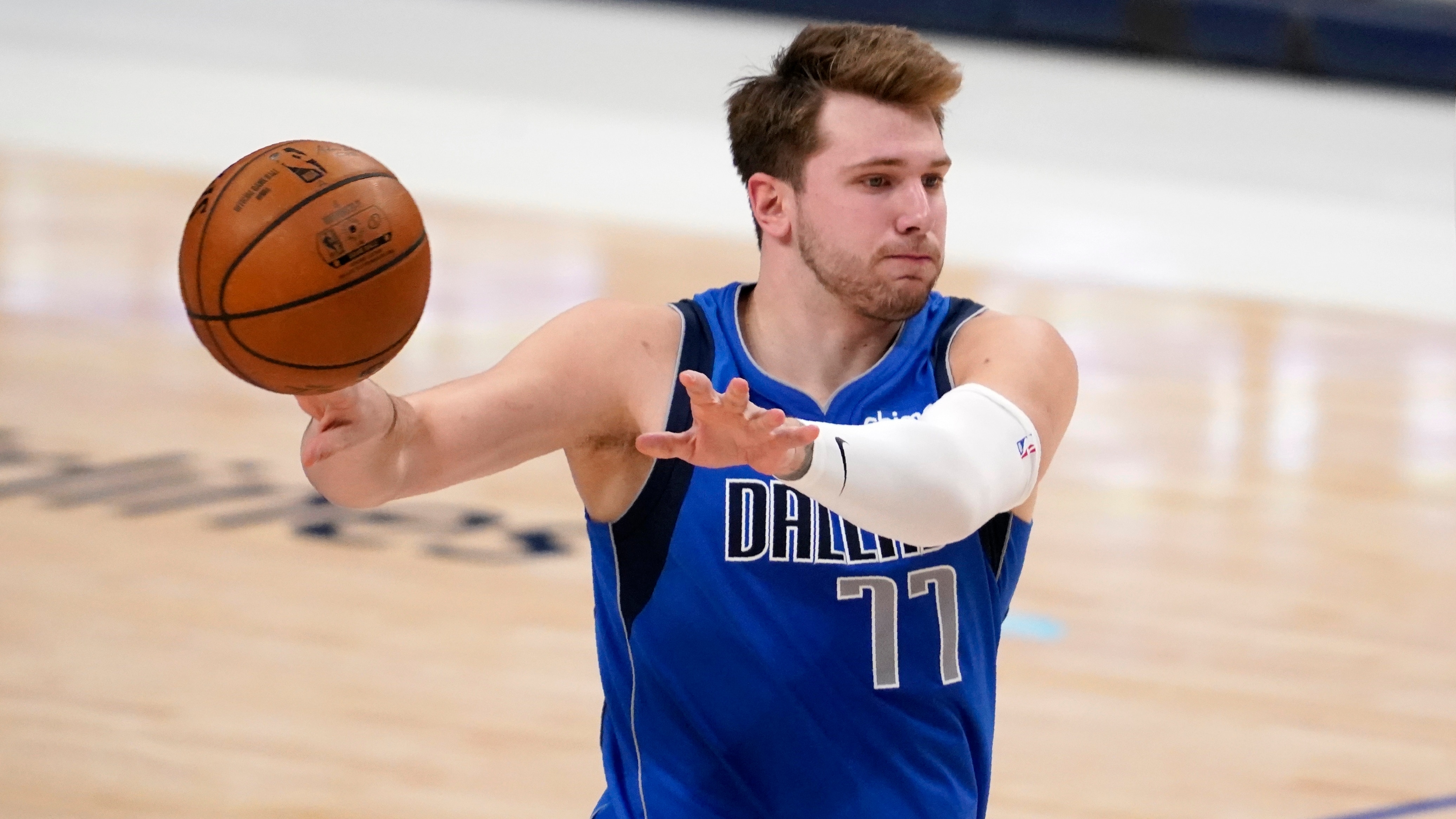 Dallas Mavericks guard Luka Doncic makes a pass in the second half of an NBA basketball game against the San Antonio Spurs in Dallas, Sunday, April 11, 2021. (AP Photo/Tony Gutierrez)