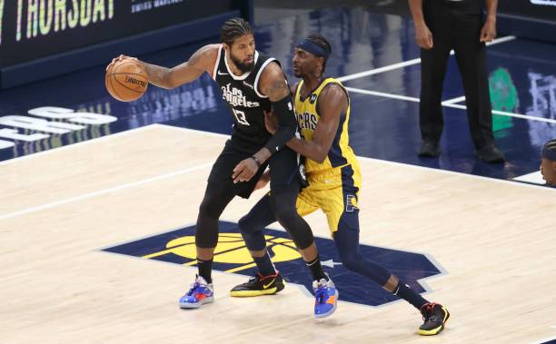 INDIANAPOLIS, INDIANA - APRIL 13:   Paul George #13 of the Los Angeles Clippers dribbles the ball against the  Indiana Pacers at Bankers Life Fieldhouse on April 13, 2021 in Indianapolis, Indiana.    NOTE TO USER: User expressly acknowledges and agrees that, by downloading and or using this Photograph, user is consenting to the terms and conditions of the Getty Images License Agreement.
 (Photo by Andy Lyons/Getty Images)