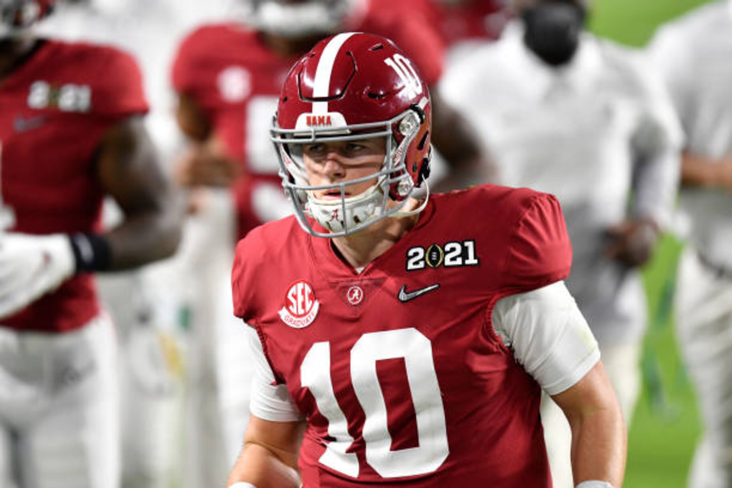 MIAMI GARDENS, FLORIDA - JANUARY 11: Mac Jones #10 of the Alabama Crimson Tide walks off the field during halftime of the College Football Playoff National Championship football game against the Ohio State Buckeyes at Hard Rock Stadium on January 11, 2021 in Miami Gardens, Florida. The Alabama Crimson Tide defeated the Ohio State Buckeyes 52-24. (Photo by Alika Jenner/Getty Images)