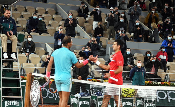 PARIS, FRANCE - OCTOBER 11: Rafael Nadal of Spain (left) shakes hands with Novak Djokovic of Serbia (not in picture) after winning the men's singles final on day fifteen of the 2020 French Open at Roland Garros on October 11, 2020 in Paris, France. The tournament was delayed from May due to the Covid-19 pandemic. (Photo by Popperfoto via Getty Images)