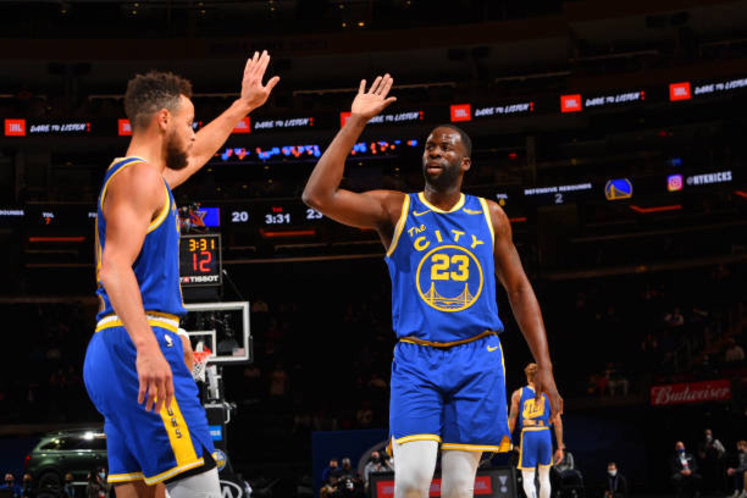 NEW YORK, NY - FEBRUARY 23: Stephen Curry #30 of the Golden State Warriors and Draymond Green #23 of the Golden State Warriors high-five during a game against the New York Knicks on February 23, 2021 at Madison Square Garden in New York City, New York. NOTE TO USER: User expressly acknowledges and agrees that, by downloading and/or using this Photograph, user is consenting to the terms and conditions of the Getty Images License Agreement. Mandatory Copyright Notice: Copyright 2021 NBAE (Photo by Jesse D. Garrabrant/NBAE via Getty Images)