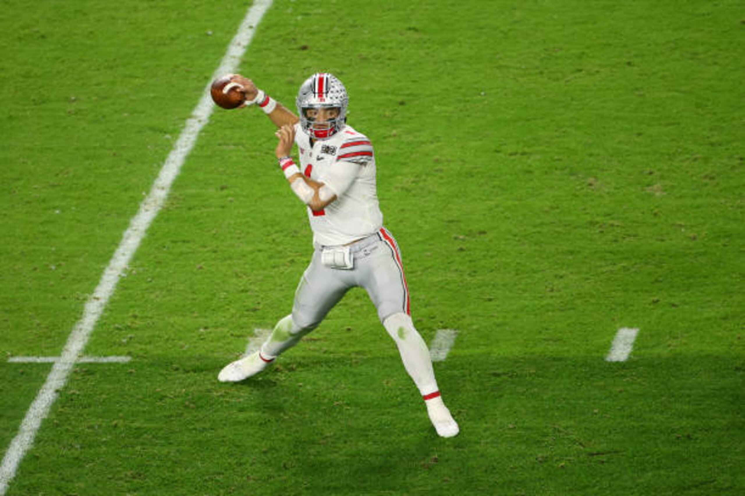 MIAMI GARDENS, FL - JANUARY 11: Justin Fields #1 of the Ohio State Buckeyes drops back to pass against the Alabama Crimson Tide during the College Football Playoff National Championship held at Hard Rock Stadium on January 11, 2021 in Miami Gardens, Florida. (Photo by Jamie Schwaberow/Getty Images)