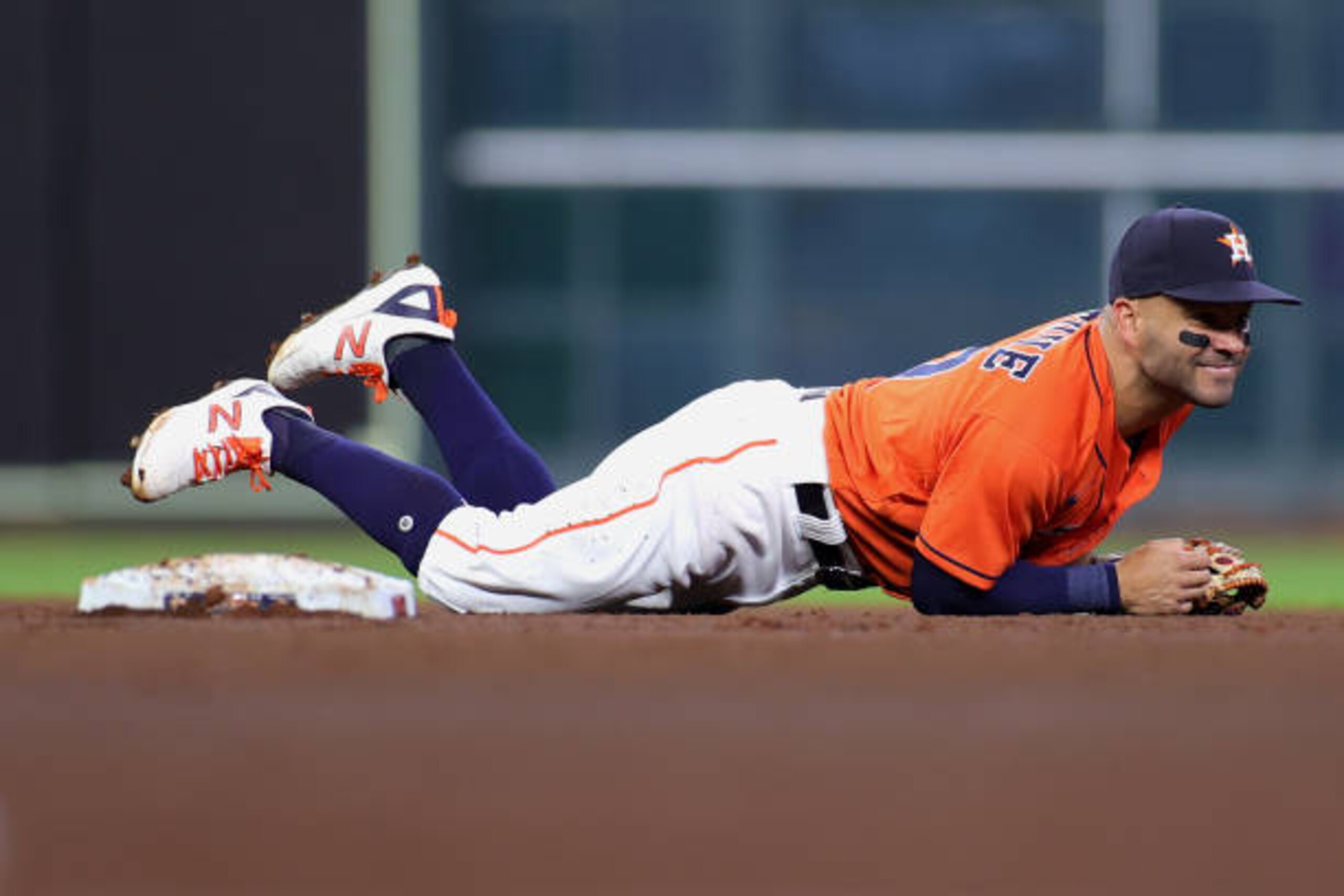 HOUSTON, TEXAS - APRIL 09: Jose Altuve #27 of the Houston Astros unable to stop the throw and tag out Matt Chapman #26 of the Oakland Athletics during the fourth inning at Minute Maid Park on April 09, 2021 in Houston, Texas. (Photo by Carmen Mandato/Getty Images)