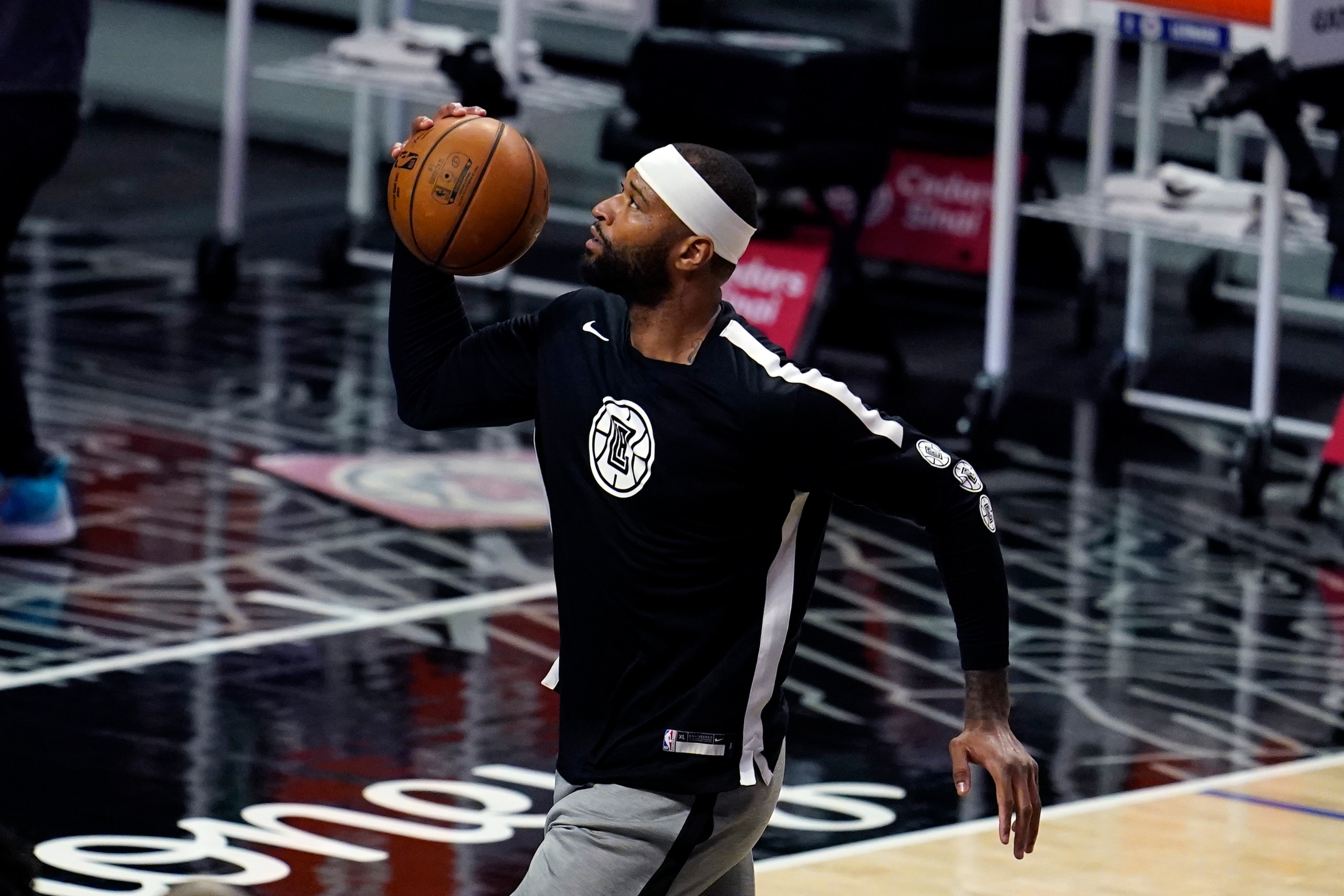 Los Angeles Clippers center DeMarcus Cousins warms up before an NBA basketball game against the Portland Trail Blazers Tuesday, April 6, 2021, in Los Angeles. (AP Photo/Marcio Jose Sanchez)
