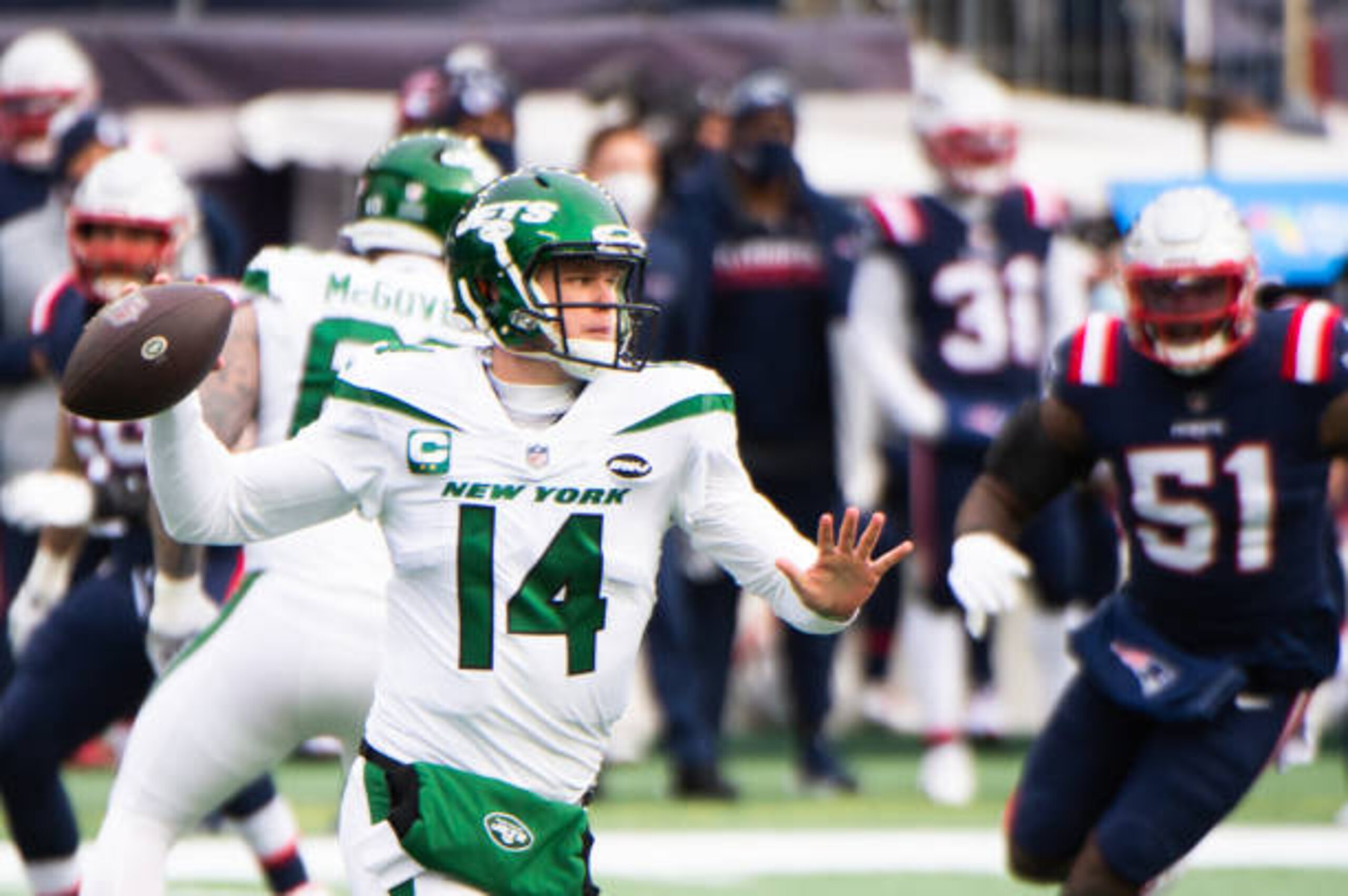 FOXBOROUGH, MA - JANUARY 3, 2021: Sam Darnold #14 of the New York Jets looks to pass in the first half against the New England Patriots at Gillette Stadium on January 3, 2021 in Foxborough, Massachusetts. (Photo by Kathryn Riley/Getty Images) FOXBOROUGH, MA - JANUARY 3, 2021: Sam Darnold #14 of the New York Jets looks to pass in the first half against the New England Patriots at Gillette Stadium on January 3, 2021 in Foxborough, Massachusetts. (Photo by Kathryn Riley/Getty Images)