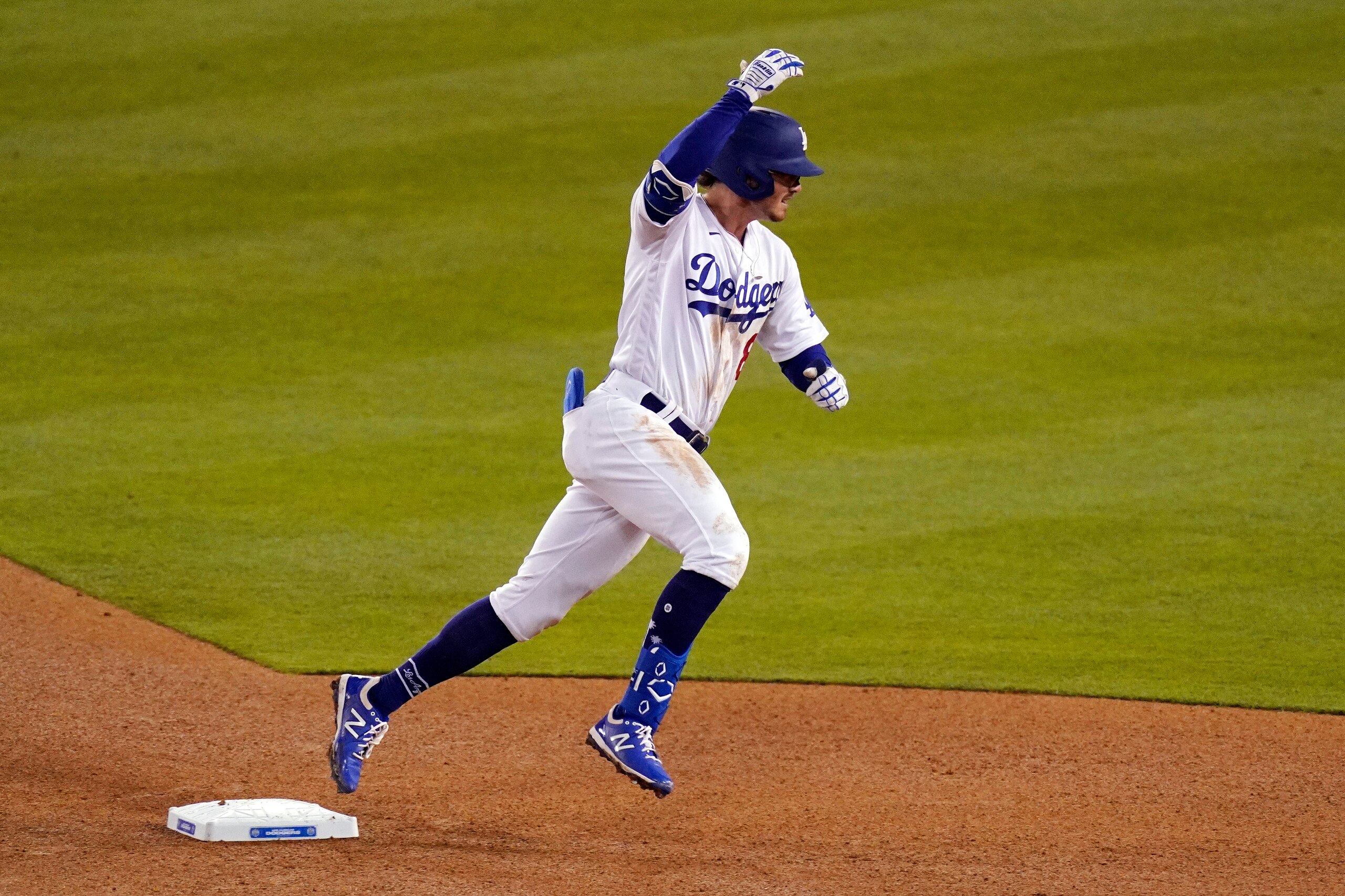 Los Angeles Dodgers' Zach McKinstry gestures towards his dugout as the rounds second after hitting a solo home run during the eighth inning of a baseball game against the Colorado Rockies Wednesday, April 14, 2021, in Los Angeles. (AP Photo/Mark J. Terrill) Los Angeles Dodgers' Zach McKinstry gestures towards his dugout as the rounds second after hitting a solo home run during the eighth inning of a baseball game against the Colorado Rockies Wednesday, April 14, 2021, in Los Angeles. (AP Photo/Mark J. Terrill)