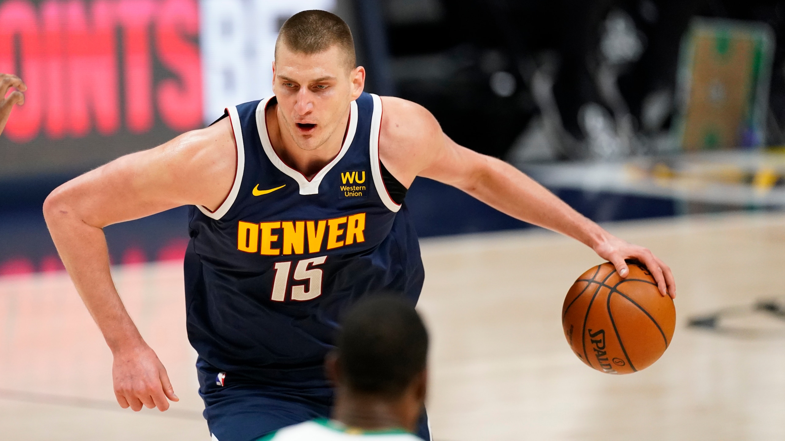 Denver Nuggets center Nikola Jokic (15) in the second half of an NBA basketball game Sunday, April 11, 2021, in Denver. (AP Photo/David Zalubowski)