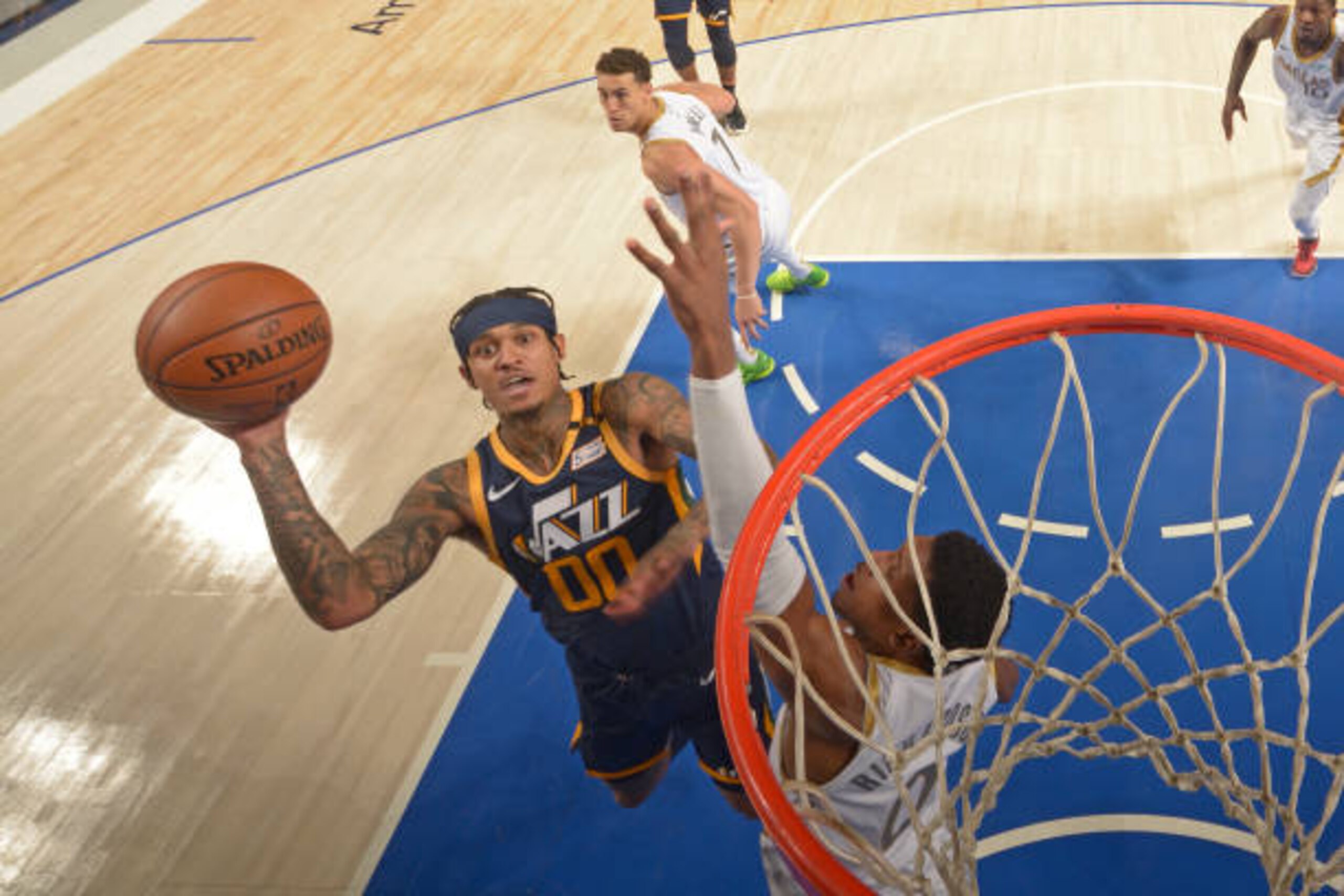 DALLAS, TX - APRIL 5:Jordan Clarkson #00 of the Utah Jazz drives to the basket against the Dallas Mavericks  on April 5, 2021 at the American Airlines Center in Dallas, Texas. NOTE TO USER: User expressly acknowledges and agrees that, by downloading and or using this photograph, User is consenting to the terms and conditions of the Getty Images License Agreement. Mandatory Copyright Notice: Copyright 2021 NBAE (Photo by Glenn James/NBAE via Getty Images)