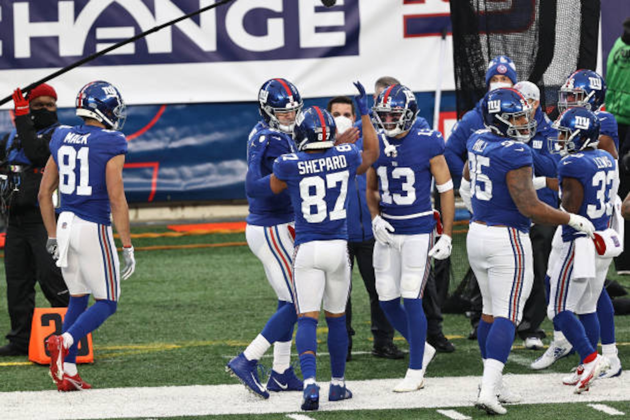 EAST RUTHERFORD, NEW JERSEY - JANUARY 03: Sterling Shepard #87 and Daniel Jones #8 of the New York Giants are congratulated by their teammates after a touchdown pass against the Dallas Cowboys during the second quarter at MetLife Stadium on January 03, 2021 in East Rutherford, New Jersey. (Photo by Elsa/Getty Images) EAST RUTHERFORD, NEW JERSEY - JANUARY 03: Sterling Shepard #87 and Daniel Jones #8 of the New York Giants are congratulated by their teammates after a touchdown pass against the Dallas Cowboys during the second quarter at MetLife Stadium on January 03, 2021 in East Rutherford, New Jersey. (Photo by Elsa/Getty Images)