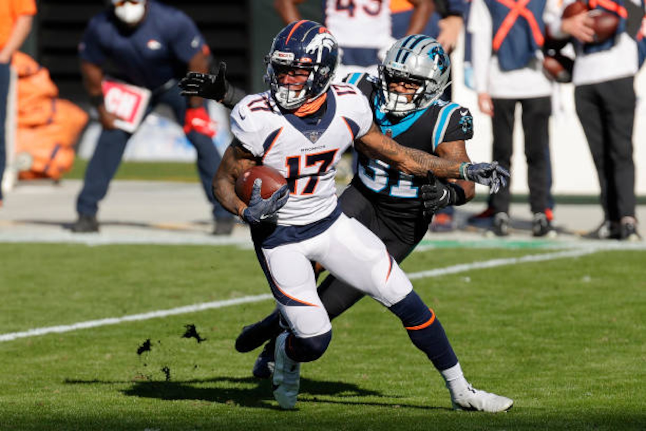 CHARLOTTE, NORTH CAROLINA - DECEMBER 13:  DaeSean Hamilton #17 of the Denver Broncos carries the ball against Juston Burris #31 of the Carolina Panthers during the second quarter at Bank of America Stadium on December 13, 2020 in Charlotte, North Carolina. (Photo by Jared C. Tilton/Getty Images)