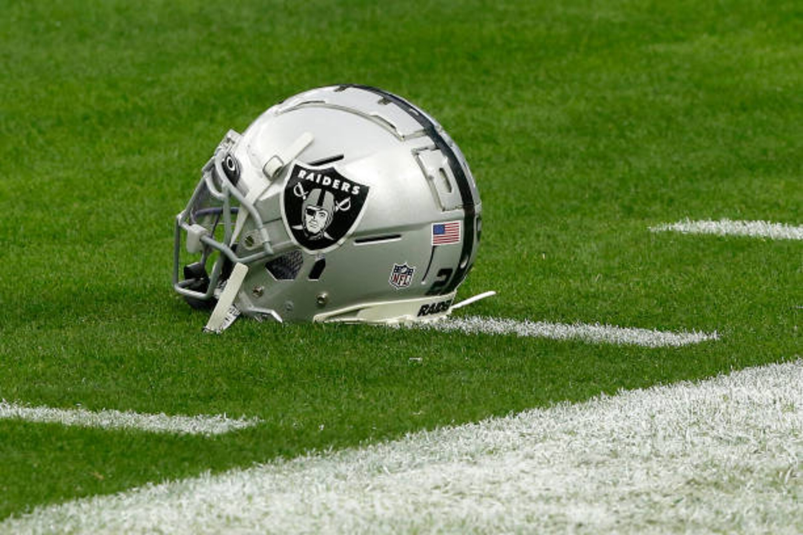 LAS VEGAS, NV - DECEMBER 13: A Las Vegas Raiders helmet sits on the turf prior to a NFL game between the Indianapolis Colts and the Las Vegas Raiders on December 13, 2020 at Allegiant Stadium, in Las Vegas, NV. (Photo by Jeffrey Brown/Icon Sportswire via Getty Images) LAS VEGAS, NV - DECEMBER 13: A Las Vegas Raiders helmet sits on the turf prior to a NFL game between the Indianapolis Colts and the Las Vegas Raiders on December 13, 2020 at Allegiant Stadium, in Las Vegas, NV. (Photo by Jeffrey Brown/Icon Sportswire via Getty Images)