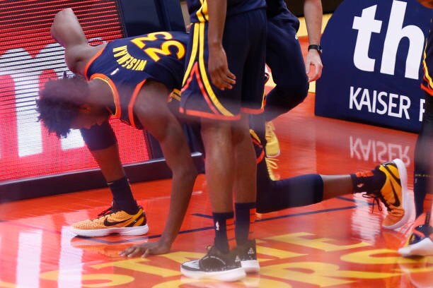 SAN FRANCISCO, CA - APRIL 10: Golden State Warriors center James Wiseman (33) reacts after landing on the floor when his dunk attempt was blocked by Houston Rockets Kenyon Martin Jr. (6) in the second quarter of an NBA game at Chase Center, Saturday, April 10, 2021, in San Francisco, Calif. Wiseman went to the locker room to get evaluated. (Santiago Mejia/The San Francisco Chronicle via Getty Images)