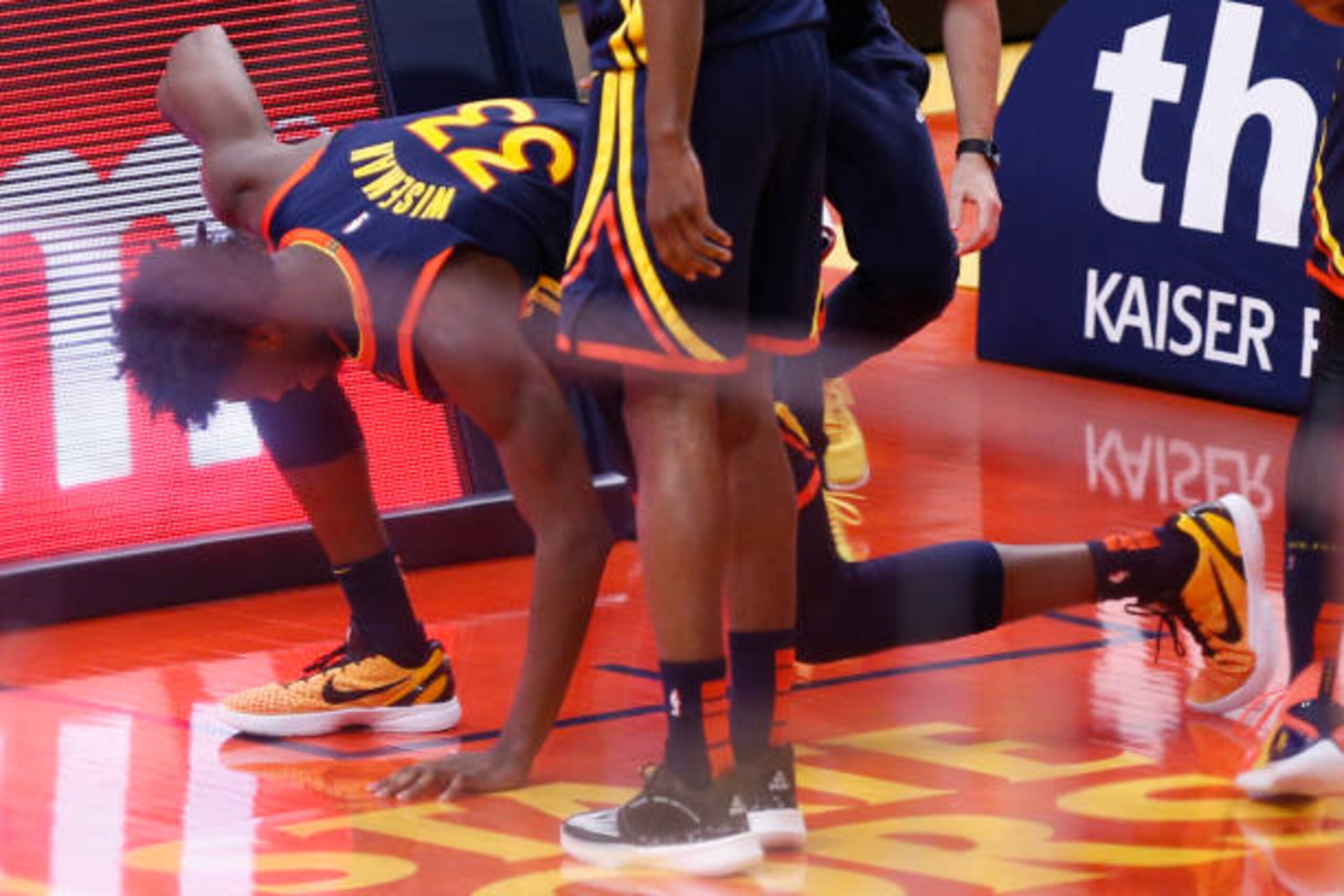 SAN FRANCISCO, CA - APRIL 10: Golden State Warriors center James Wiseman (33) reacts after landing on the floor when his dunk attempt was blocked by Houston Rockets Kenyon Martin Jr. (6) in the second quarter of an NBA game at Chase Center, Saturday, April 10, 2021, in San Francisco, Calif. Wiseman went to the locker room to get evaluated. (Santiago Mejia/The San Francisco Chronicle via Getty Images)