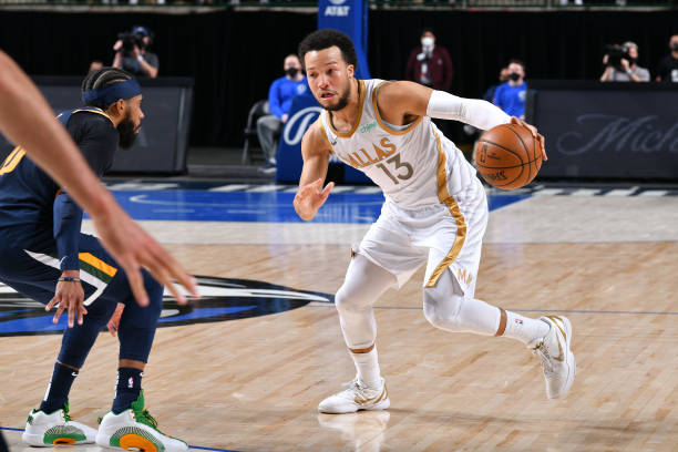 DALLAS, TX - APRIL 5: Jalen Brunson #13 of the Dallas Mavericks dribbles the ball against the Utah Jazz on April 5, 2021 at the American Airlines Center in Dallas, Texas. NOTE TO USER: User expressly acknowledges and agrees that, by downloading and or using this photograph, User is consenting to the terms and conditions of the Getty Images License Agreement. Mandatory Copyright Notice: Copyright 2021 NBAE (Photo by Glenn James/NBAE via Getty Images)