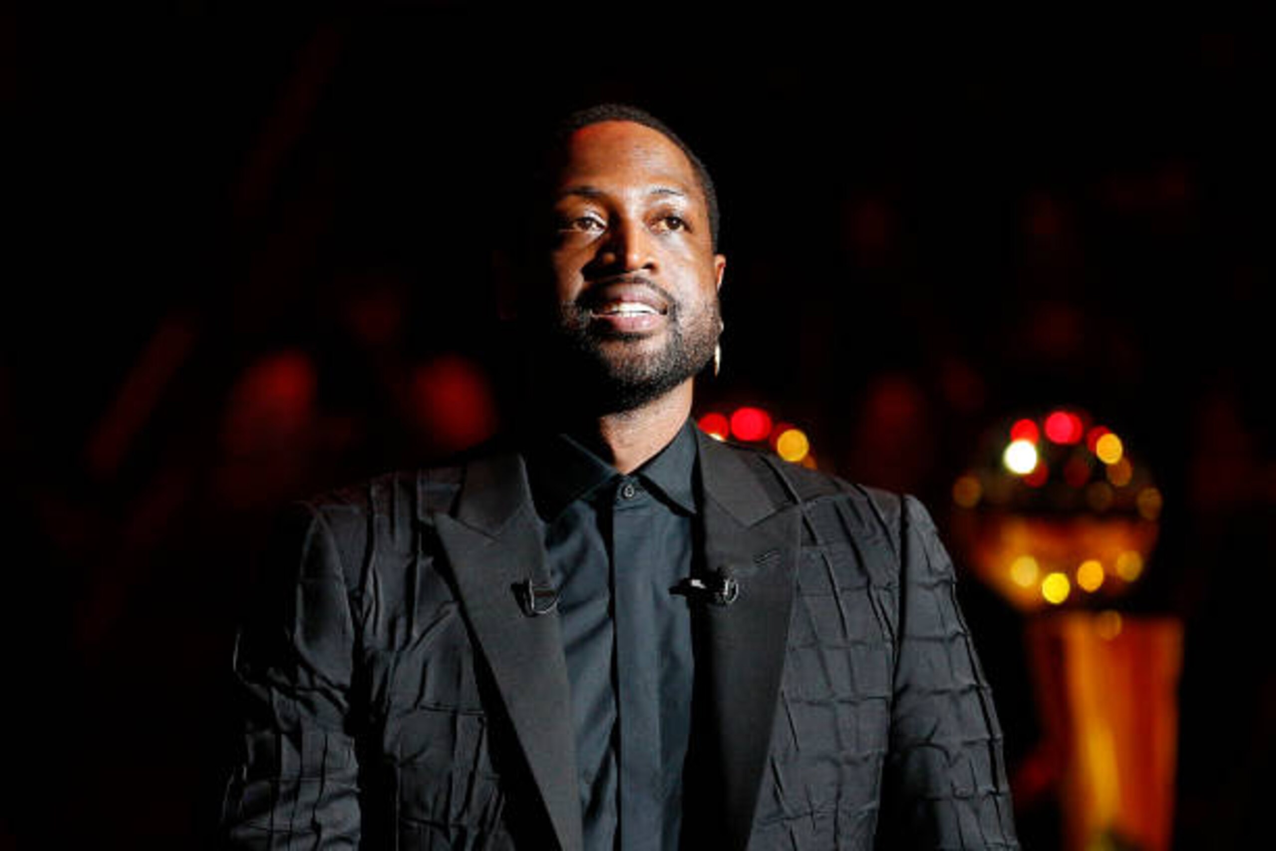 MIAMI, FLORIDA - FEBRUARY 22:  Former Miami Heat player Dwyane Wade addresses the crowd during his jersey retirement ceremony at American Airlines Arena on February 22, 2020 in Miami, Florida. NOTE TO USER: User expressly acknowledges and agrees that, by downloading and/or using this photograph, user is consenting to the terms and conditions of the Getty Images License Agreement.  (Photo by Michael Reaves/Getty Images)