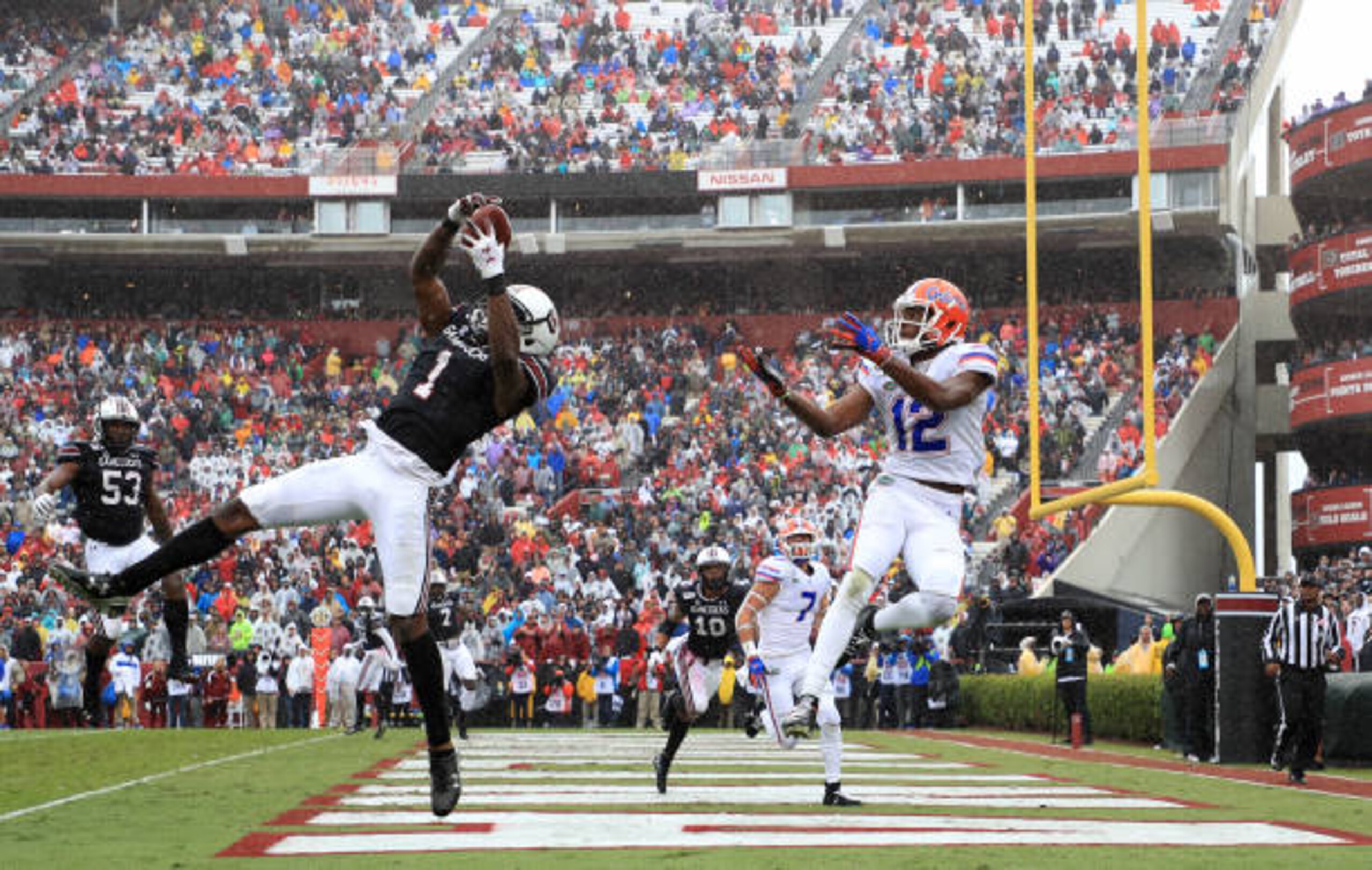 COLUMBIA, SOUTH CAROLINA - OCTOBER 19: Jaycee Horn #1 of the South Carolina Gamecocks goes after a pass against C.J. McWilliams #12 of the Florida Gators during their game at Williams-Brice Stadium on October 19, 2019 in Columbia, South Carolina. (Photo by Streeter Lecka/Getty Images) COLUMBIA, SOUTH CAROLINA - OCTOBER 19: Jaycee Horn #1 of the South Carolina Gamecocks goes after a pass against C.J. McWilliams #12 of the Florida Gators during their game at Williams-Brice Stadium on October 19, 2019 in Columbia, South Carolina. (Photo by Streeter Lecka/Getty Images)