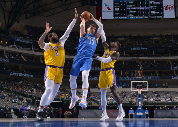 DALLAS, TX - APRIL 22: Luka Doncic #77 of the Dallas Mavericks shoots the ball against the Los Angeles Lakers on April 22, 2021 at the American Airlines Center in Dallas, Texas. NOTE TO USER: User expressly acknowledges and agrees that, by downloading and or using this photograph, User is consenting to the terms and conditions of the Getty Images License Agreement. Mandatory Copyright Notice: Copyright 2021 NBAE (Photo by Glenn James/NBAE via Getty Images)