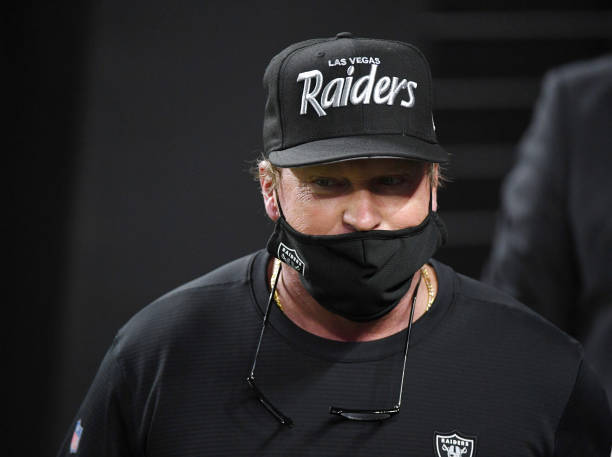 LAS VEGAS, NEVADA - DECEMBER 17:  Head coach Jon Gruden of the Las Vegas Raiders walks onto the field for the second half of a game against the Los Angeles Chargers at Allegiant Stadium on December 17, 2020 in Las Vegas, Nevada. The Chargers defeated the Raiders 30-27 in overtime.  (Photo by Ethan Miller/Getty Images)