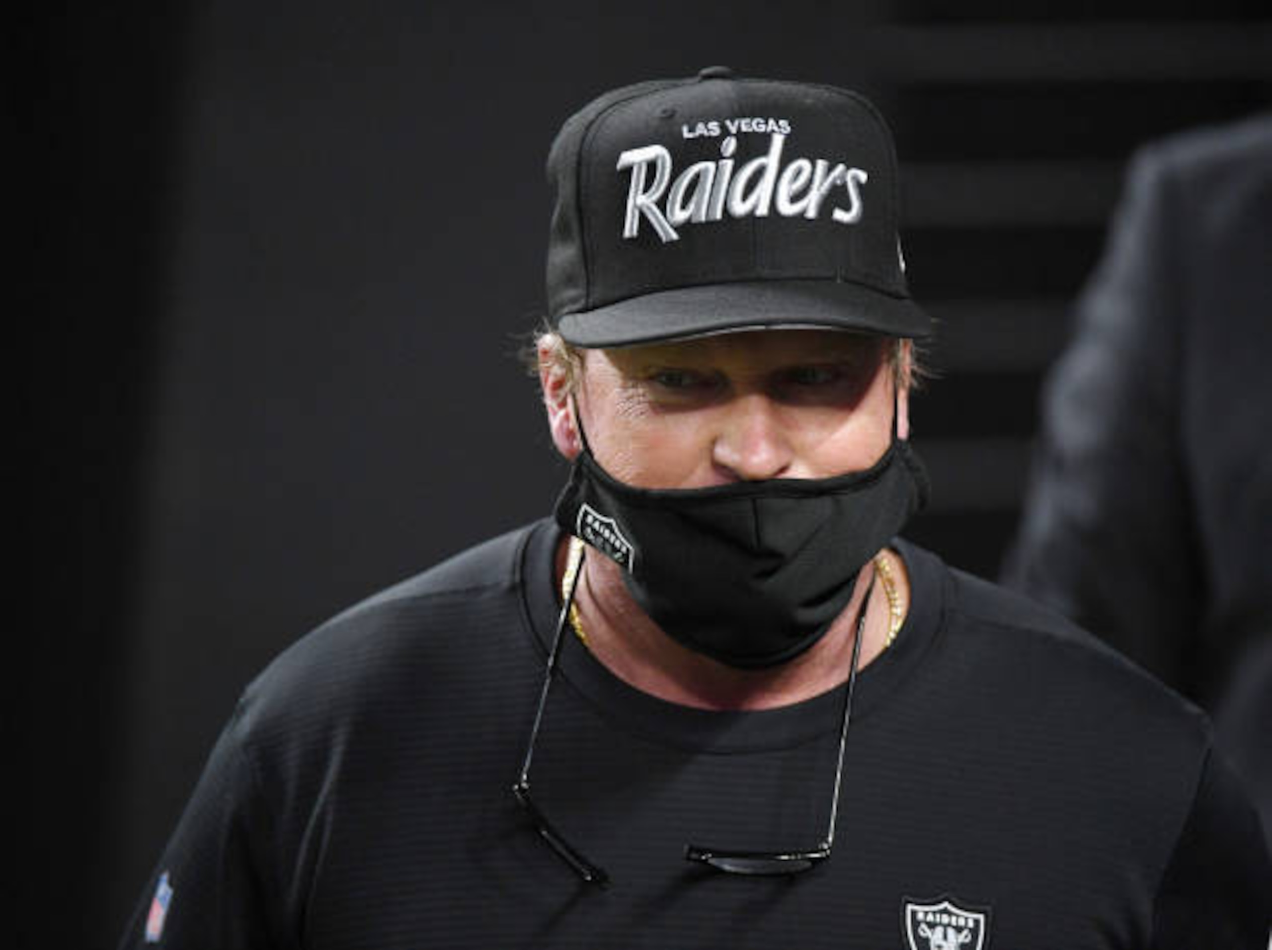 LAS VEGAS, NEVADA - DECEMBER 17:  Head coach Jon Gruden of the Las Vegas Raiders walks onto the field for the second half of a game against the Los Angeles Chargers at Allegiant Stadium on December 17, 2020 in Las Vegas, Nevada. The Chargers defeated the Raiders 30-27 in overtime.  (Photo by Ethan Miller/Getty Images)