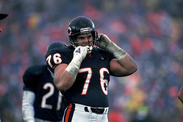 CHICAGO - DECEMBER 30:  Steve McMichael #76 of the Chicago Bears removes his helmet during the game against the Kansas City Chiefs on December 30, 1990 in Chicago, Illinois. The Chiefs won 21-10. (Photo by Jonathan Daniel/Getty Images)