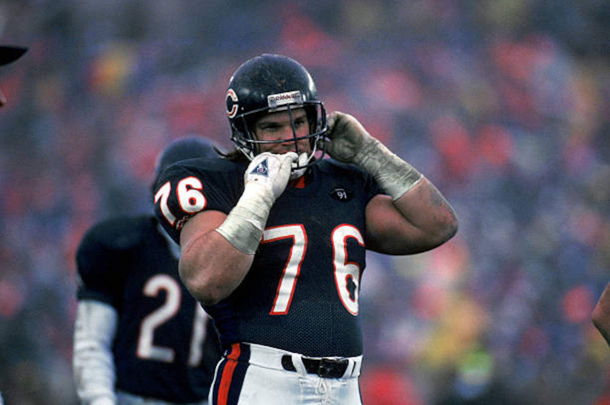 CHICAGO - DECEMBER 30:  Steve McMichael #76 of the Chicago Bears removes his helmet during the game against the Kansas City Chiefs on December 30, 1990 in Chicago, Illinois. The Chiefs won 21-10. (Photo by Jonathan Daniel/Getty Images)