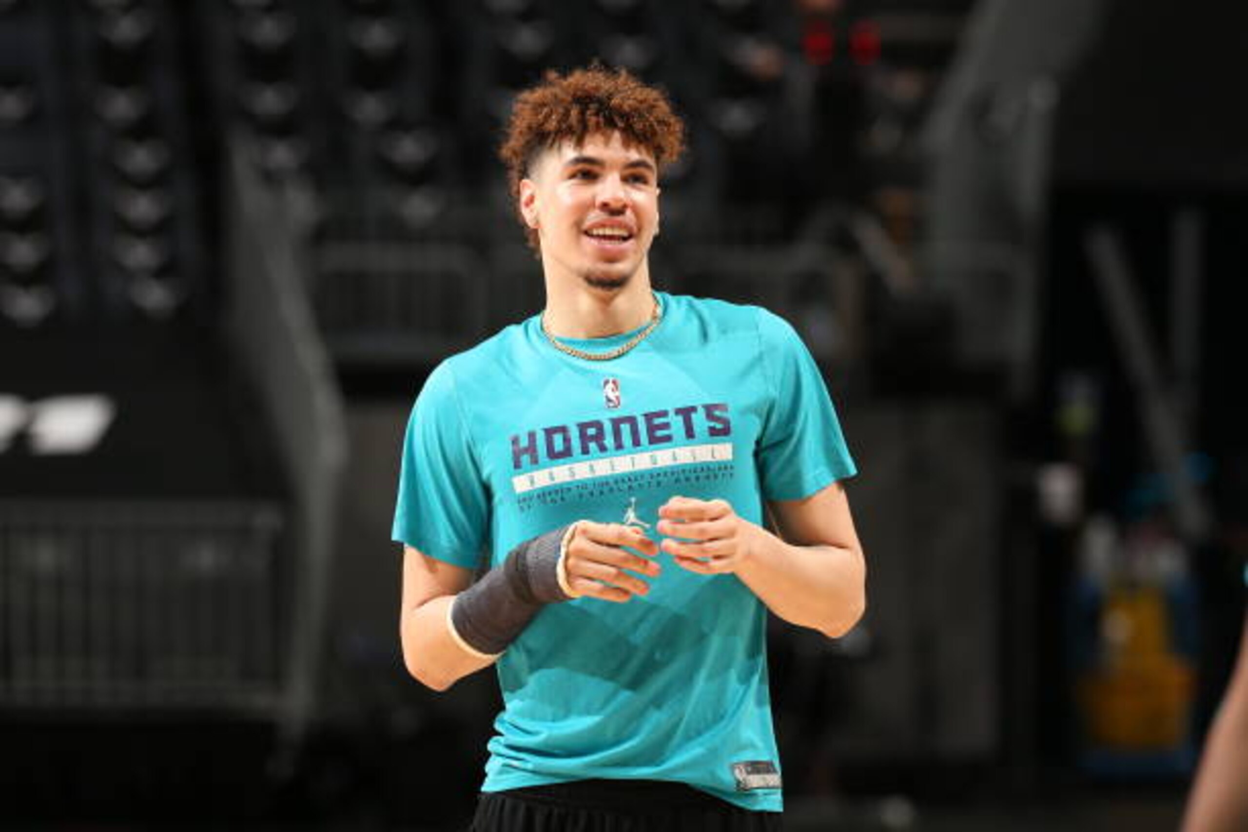 CHARLOTTE, NC - APRIL 11: LaMelo Ball #2 of the Charlotte Hornets smiles before the game against the Atlanta Hawks on April 11, 2021 at Spectrum Center in Charlotte, North Carolina. NOTE TO USER: User expressly acknowledges and agrees that, by downloading and or using this photograph, User is consenting to the terms and conditions of the Getty Images License Agreement.  Mandatory Copyright Notice:  Copyright 2021 NBAE (Photo by Kent Smith/NBAE via Getty Images)