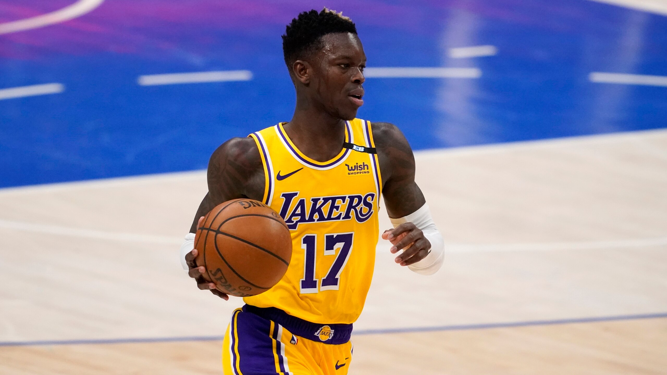 Los Angeles Lakers' Dennis Schroder handles the ball during an NBA basketball game against the Dallas Mavericks in Dallas, Thursday, April 22, 2021. (AP Photo/Tony Gutierrez) Los Angeles Lakers' Dennis Schroder handles the ball during an NBA basketball game against the Dallas Mavericks in Dallas, Thursday, April 22, 2021. (AP Photo/Tony Gutierrez)