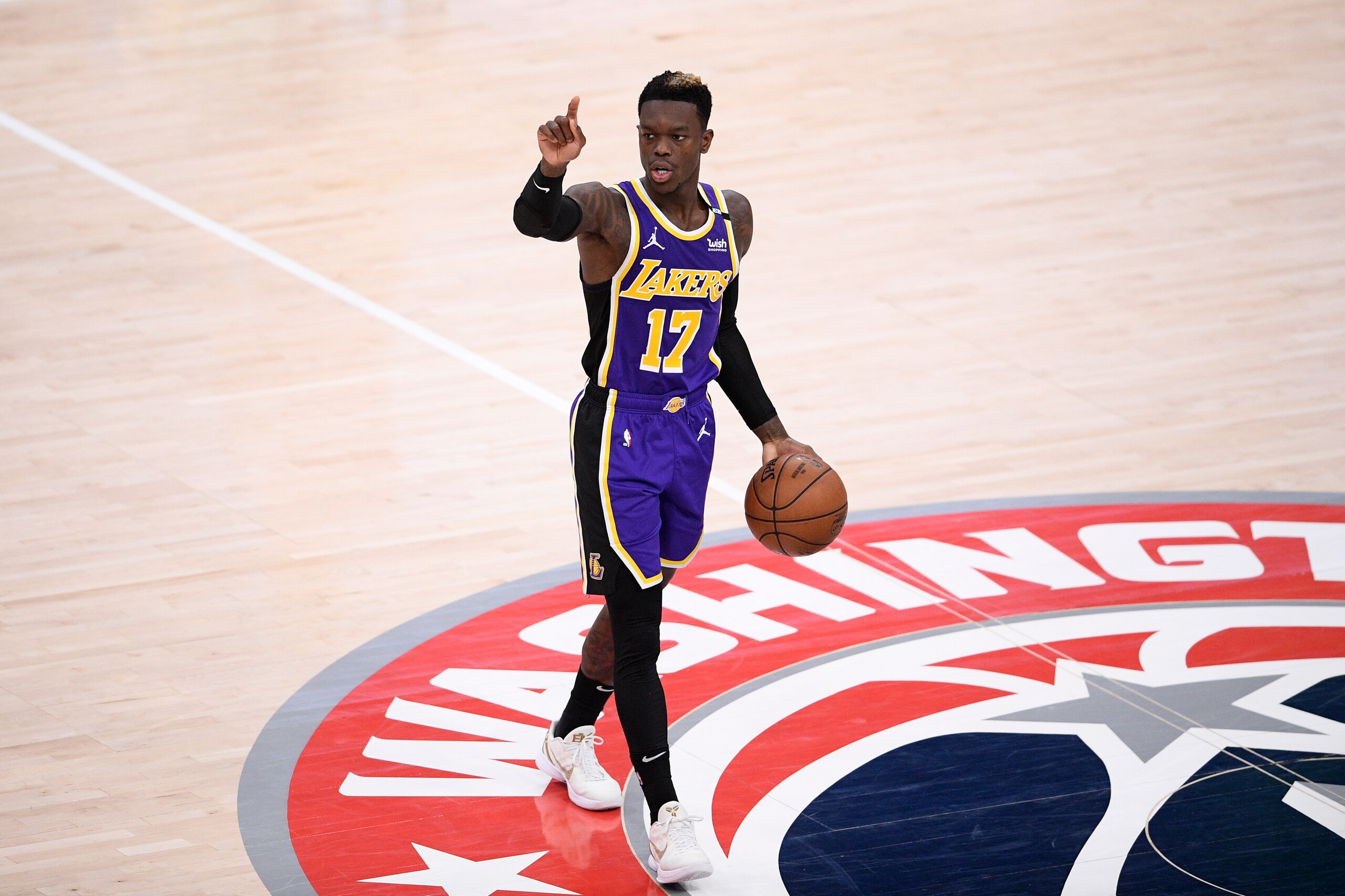 Los Angeles Lakers guard Dennis Schroder (17) dribbles the ball during the second half of an NBA basketball game against the Washington Wizards, Wednesday, April 28, 2021, in Washington. (AP Photo/Nick Wass) Los Angeles Lakers guard Dennis Schroder (17) dribbles the ball during the second half of an NBA basketball game against the Washington Wizards, Wednesday, April 28, 2021, in Washington. (AP Photo/Nick Wass)