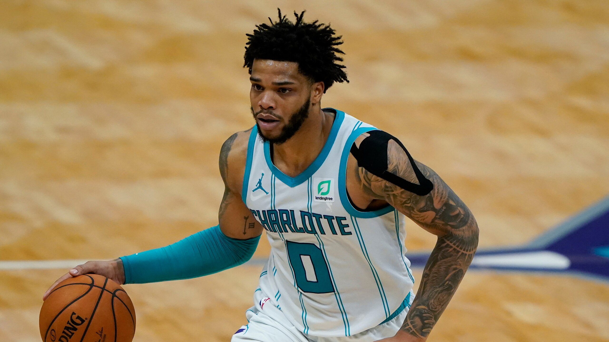Charlotte Hornets forward Miles Bridges brings the ball down court against the Miami Heat during the second half of an NBA basketball game on Sunday, May 2, 2021, in Charlotte, N.C. (AP Photo/Chris Carlson)
