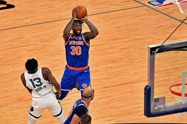 MEMPHIS, TENNESSEE - MAY 03: Julius Randle #30 of the New York Knicks shoots against Jaren Jackson Jr. #13 of the Memphis Grizzlies during the second half at FedExForum on May 03, 2021 in Memphis, Tennessee. NOTE TO USER: User expressly acknowledges and agrees that, by downloading and or using this photograph, User is consenting to the terms and conditions of the Getty Images License Agreement. (Photo by Justin Ford/Getty Images)