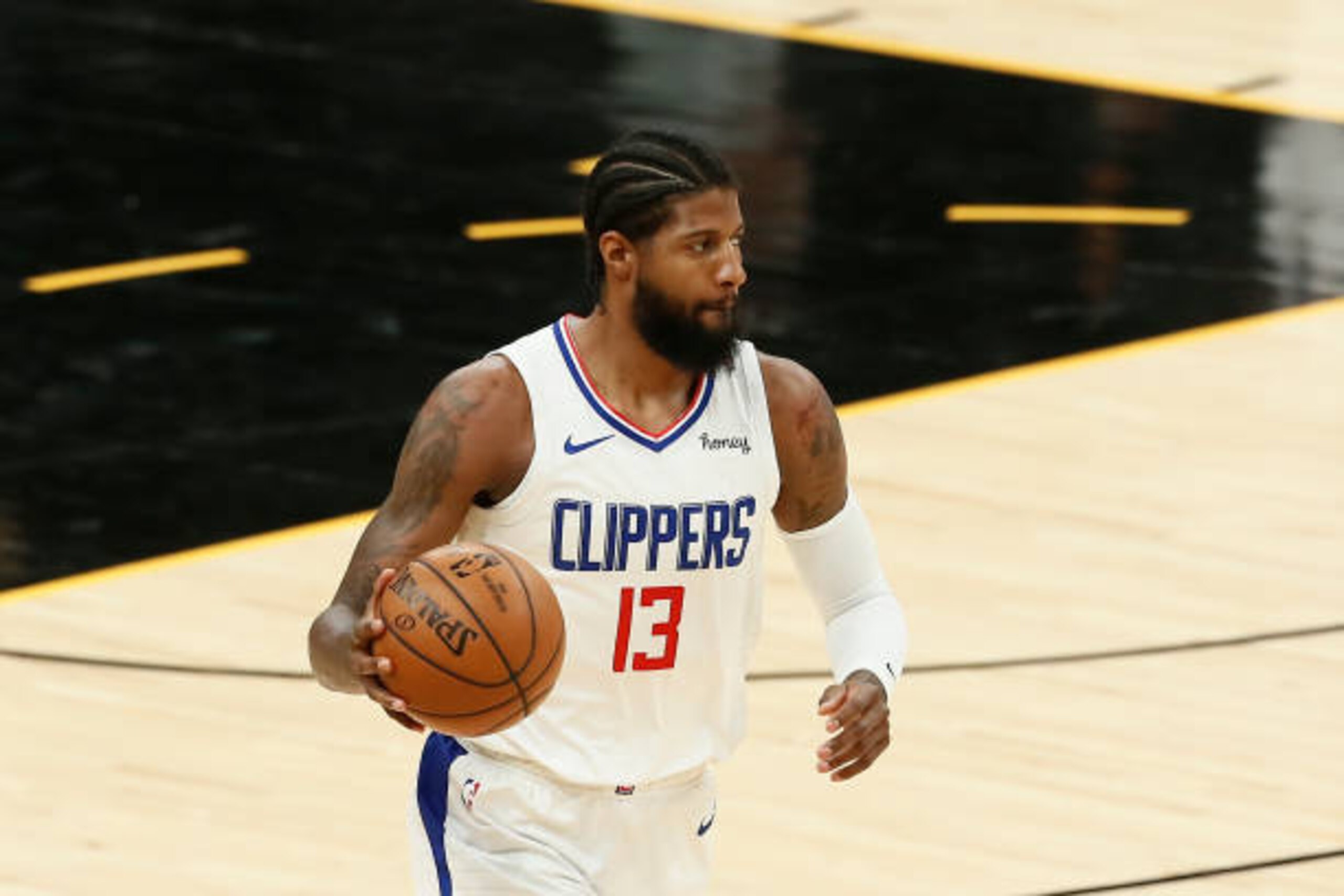 PHOENIX, AZ - APRIL 28: Paul George #13 of the LA Clippers dribbles the ball during the game against the Phoenix Suns on April 28, 2021 at Phoenix Suns Arena in Phoenix, Arizona. NOTE TO USER: User expressly acknowledges and agrees that, by downloading and or using this photograph, user is consenting to the terms and conditions of the Getty Images License Agreement. Mandatory Copyright Notice: Copyright 2021 NBAE (Photo by Chris Elise/NBAE via Getty Images) PHOENIX, AZ - APRIL 28: Paul George #13 of the LA Clippers dribbles the ball during the game against the Phoenix Suns on April 28, 2021 at Phoenix Suns Arena in Phoenix, Arizona. NOTE TO USER: User expressly acknowledges and agrees that, by downloading and or using this photograph, user is consenting to the terms and conditions of the Getty Images License Agreement. Mandatory Copyright Notice: Copyright 2021 NBAE (Photo by Chris Elise/NBAE via Getty Images)