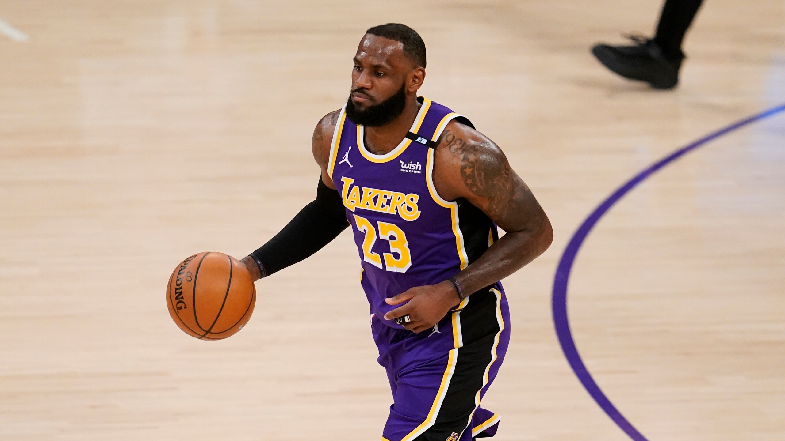 Los Angeles Lakers forward LeBron James dribbles during the first half of an NBA basketball game against the Sacramento Kings Friday, April 30, 2021, in Los Angeles. (AP Photo/Marcio Jose Sanchez)