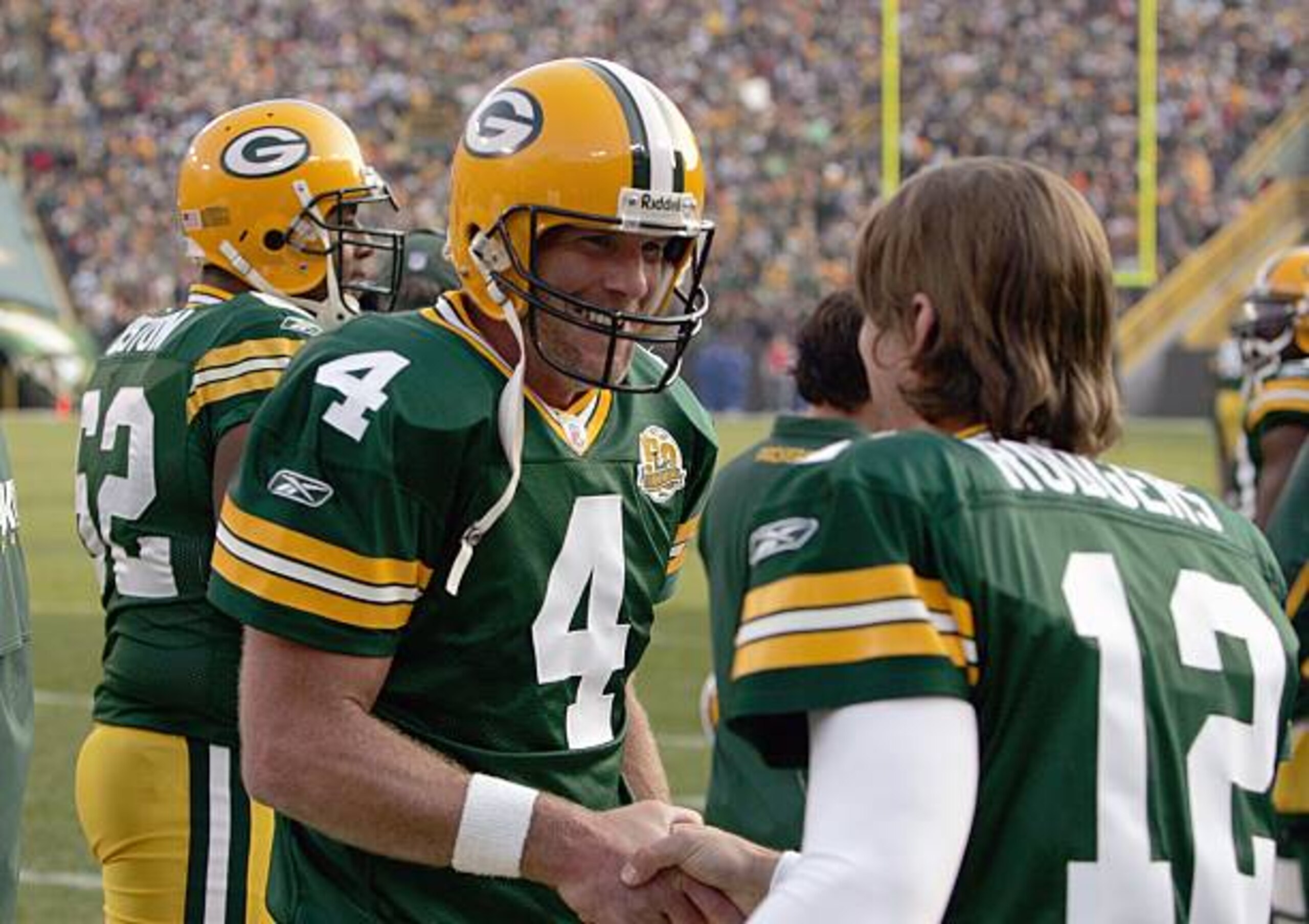 GREEN BAY, WI - NOVEMBER 11: Brett Favre #4 of the Green Bay Packers talks with  Aaron Rodgers #12 during the game against the Minnesota Vikings give chase on November 11, 2007 at Lambeau Field in Green Bay, Wisconsin. (Photo by Jonathan Daniel/Getty Images)