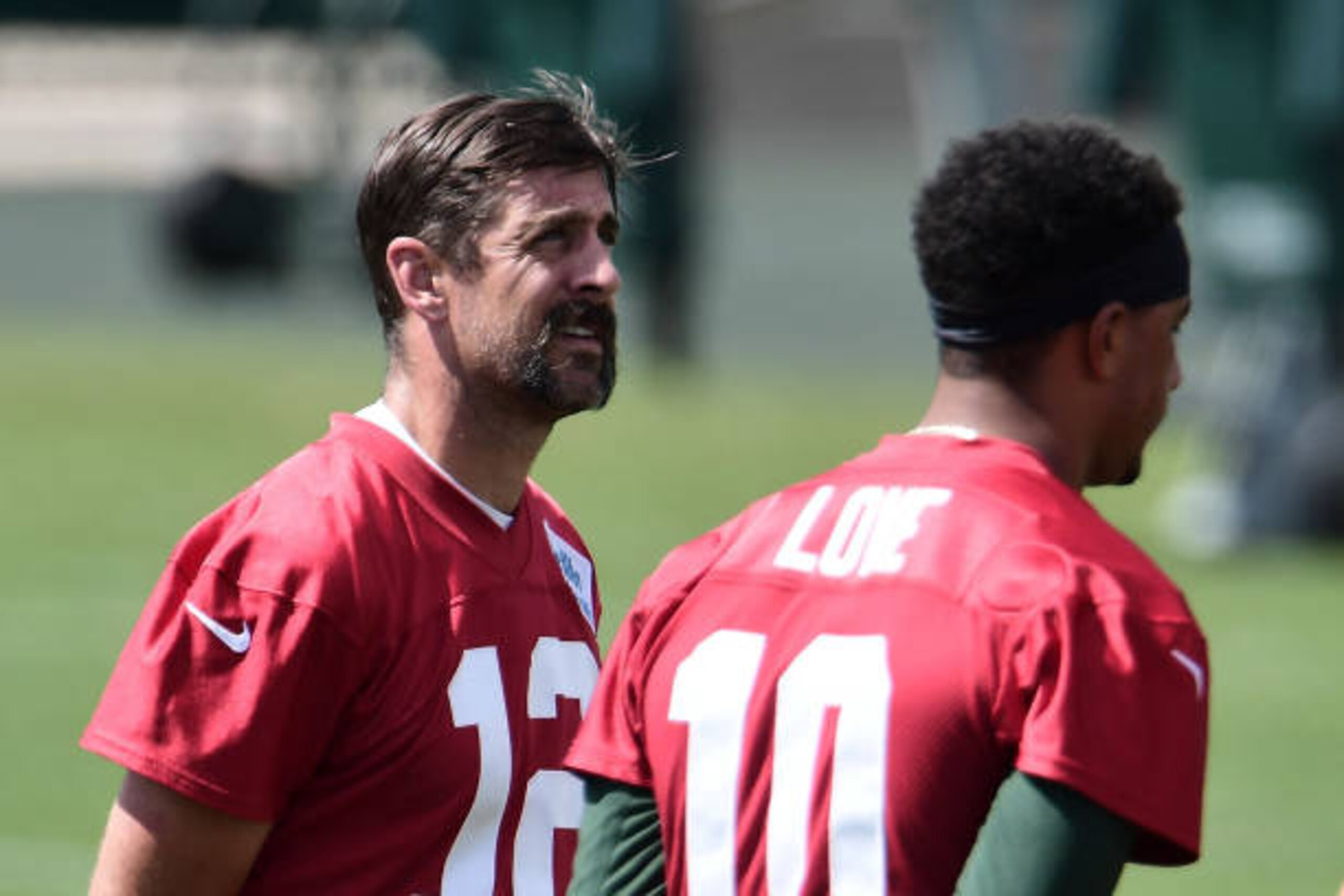 ASHWAUBENON, WISCONSIN - AUGUST 17: Aaron Rodgers #12 of the Green Bay Packers stands with Jordan Love #10 during training camp at Ray Nitschke Field on August 17, 2020 in Ashwaubenon, Wisconsin. (Photo by Stacy Revere/Getty Images)