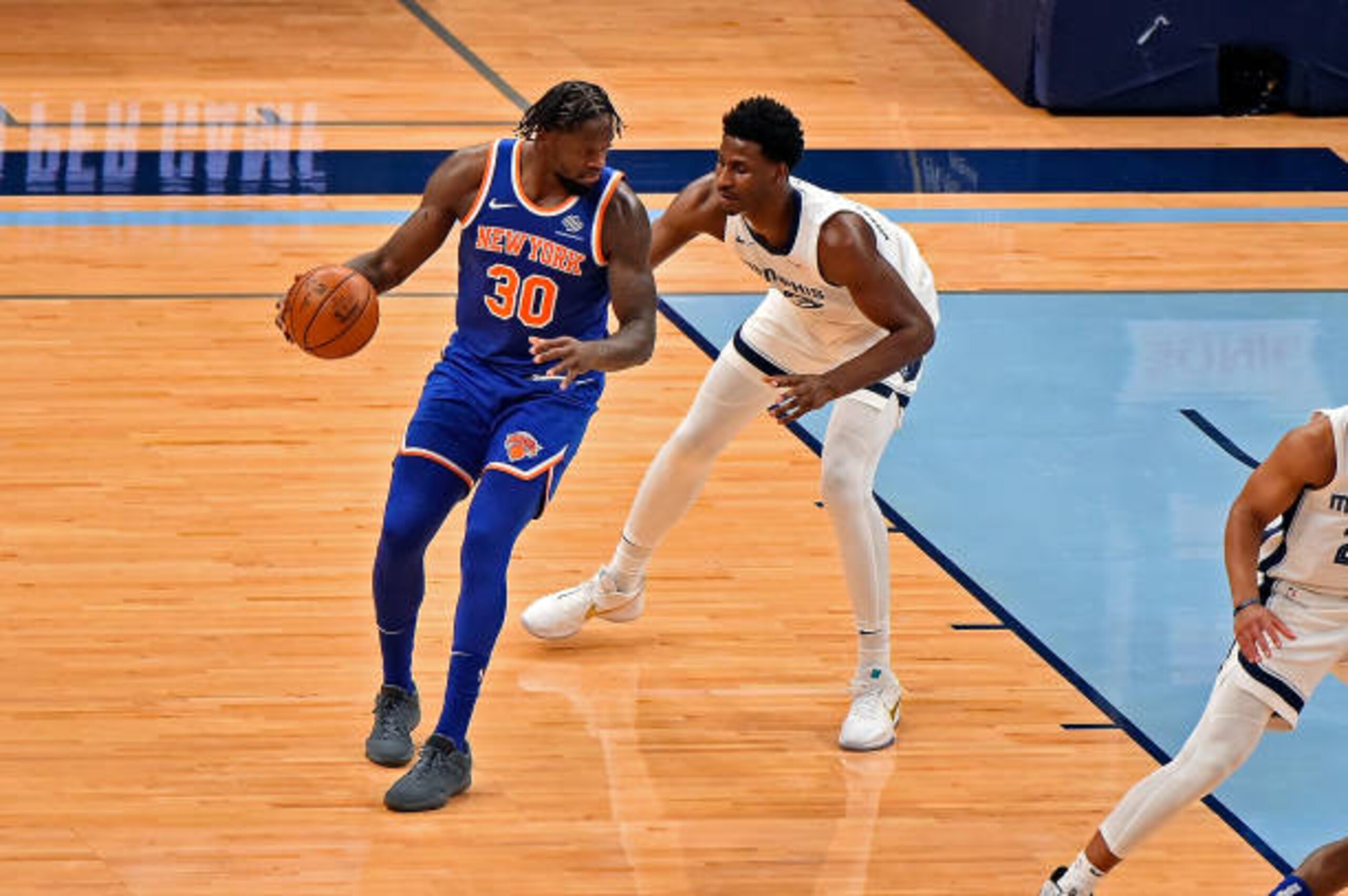 MEMPHIS, TENNESSEE - MAY 03: Julius Randle #30 of the New York Knicks handles the ball against Jaren Jackson Jr. #13 of the Memphis Grizzlies during the first half at FedExForum on May 03, 2021 in Memphis, Tennessee. NOTE TO USER: User expressly acknowledges and agrees that, by downloading and or using this photograph, User is consenting to the terms and conditions of the Getty Images License Agreement. (Photo by Justin Ford/Getty Images)
