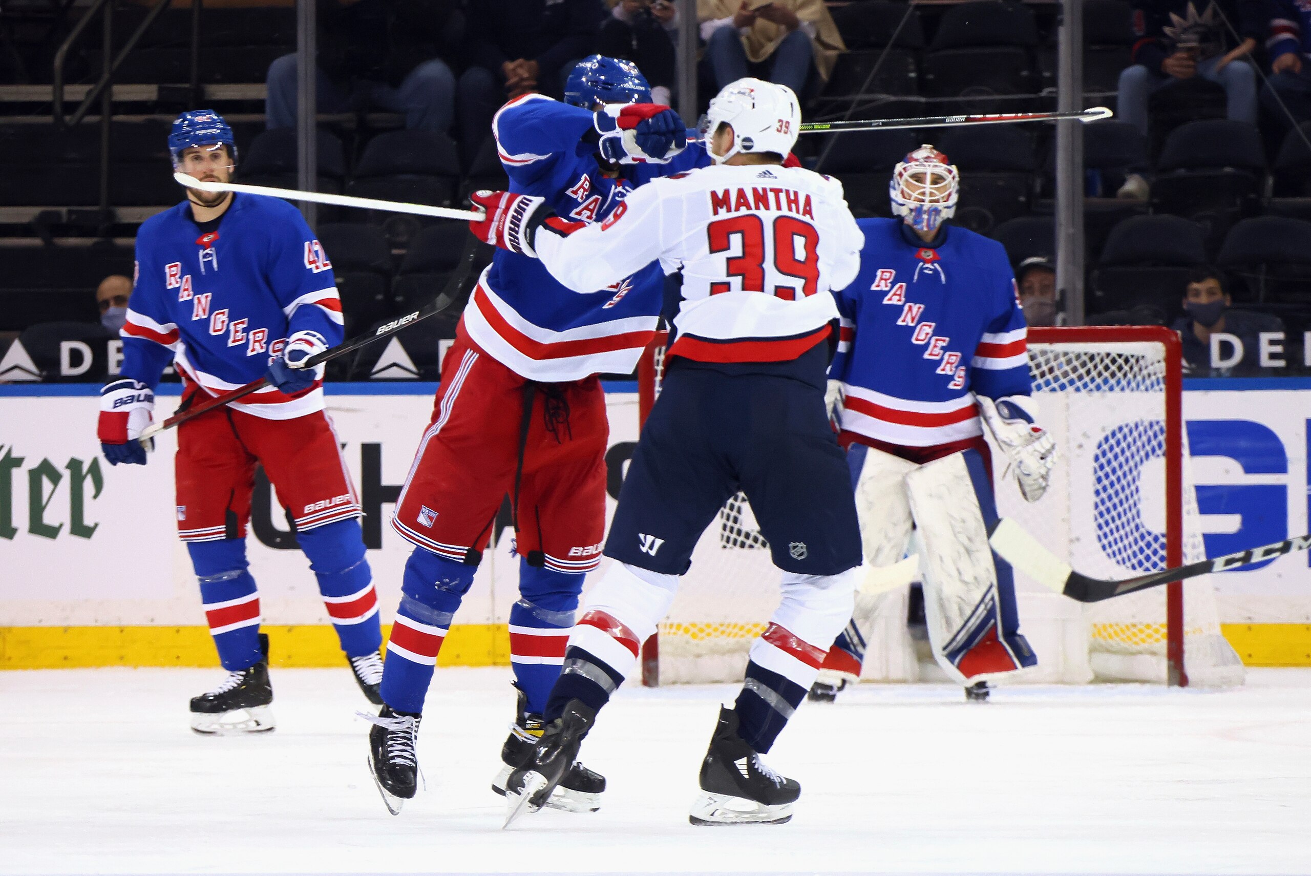 New York Rangers' Pavel Buchnevich (89) hits Washington Capitals' Anthony Mantha (39) with his stick during the second period of an NHL hockey game Wednesday, May 5, 2021, in New York. Buchnevich was penalized for high-sticking. (Bruce Bennett/Pool Photo via AP) New York Rangers' Pavel Buchnevich (89) hits Washington Capitals' Anthony Mantha (39) with his stick during the second period of an NHL hockey game Wednesday, May 5, 2021, in New York. Buchnevich was penalized for high-sticking. (Bruce Bennett/Pool Photo via AP)