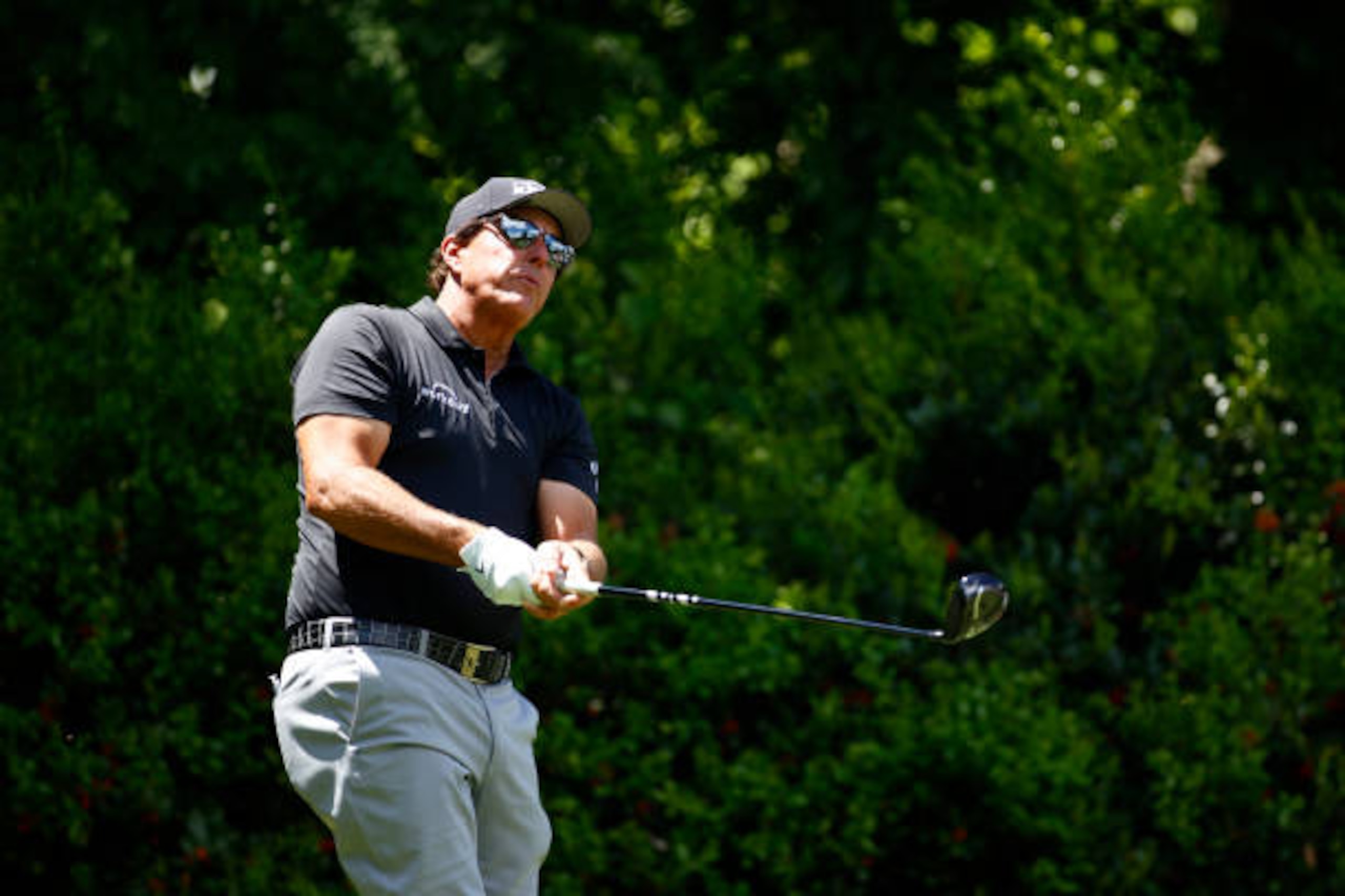 CHARLOTTE, NORTH CAROLINA - MAY 06: Phil Mickelson of the United States plays his shot from the 12th tee during the first round of the 2021 Wells Fargo Championship at Quail Hollow Club on May 06, 2021 in Charlotte, North Carolina. (Photo by Jared C. Tilton/Getty Images)
